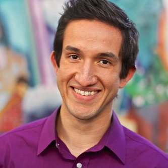 Michael Vargas is therapist coach for zynnyme and isa latino male wearing a purple button up shirt