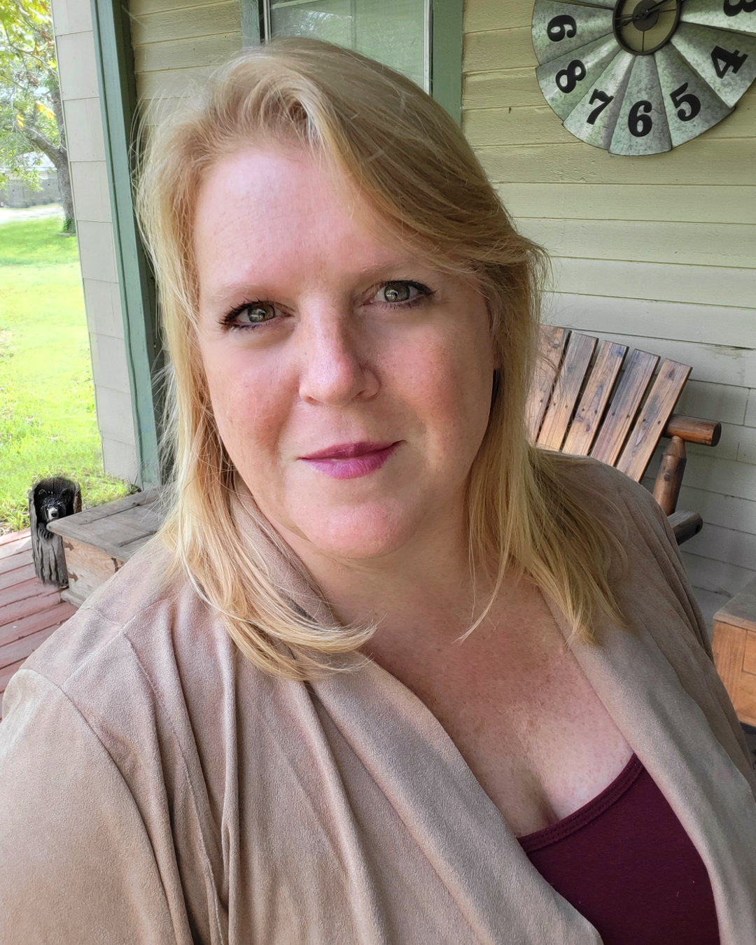 Jennie is a therapist coach at zynnyme, a white woman with blonde hair, wearing a tan cardigan and maroon top