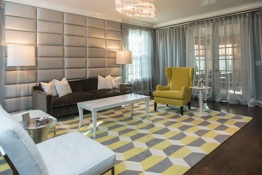 For this project, my clients knew they wanted to invest in a statement rug — a piece that would anchor the entire space. Its geometric pattern and yellow accents became the foundation for the design, adding warmth and vibrancy.
The upholstered