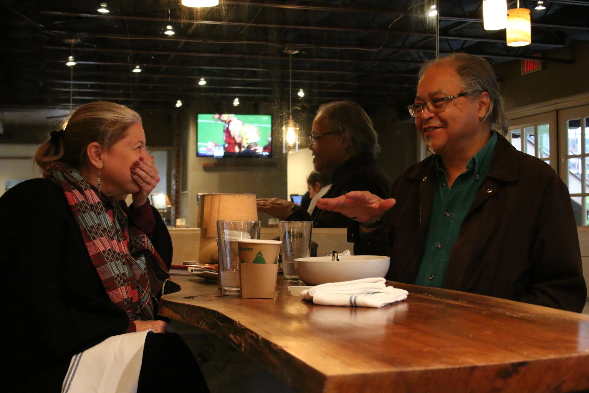Danny Bell, retired UNC-Chapel Hill staff member of Coharie and Lumbee descent, meets with current UNC Assisstant Professor Lisa Villamil at Tru Deli and Wine Bar in Chapel Hill, N.C. on Tuesday, Dec. 10, 2019. They discussed Villamil's current proje