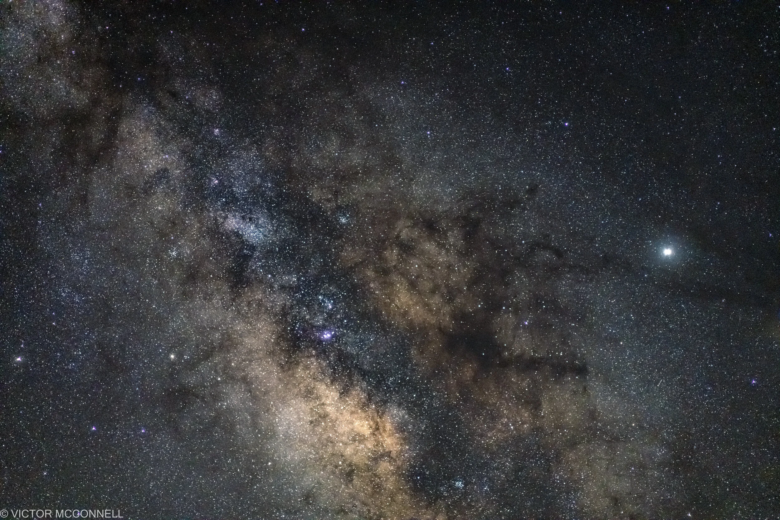 A detailed view of the night sky showing countless stars and the Milky Way galaxy.