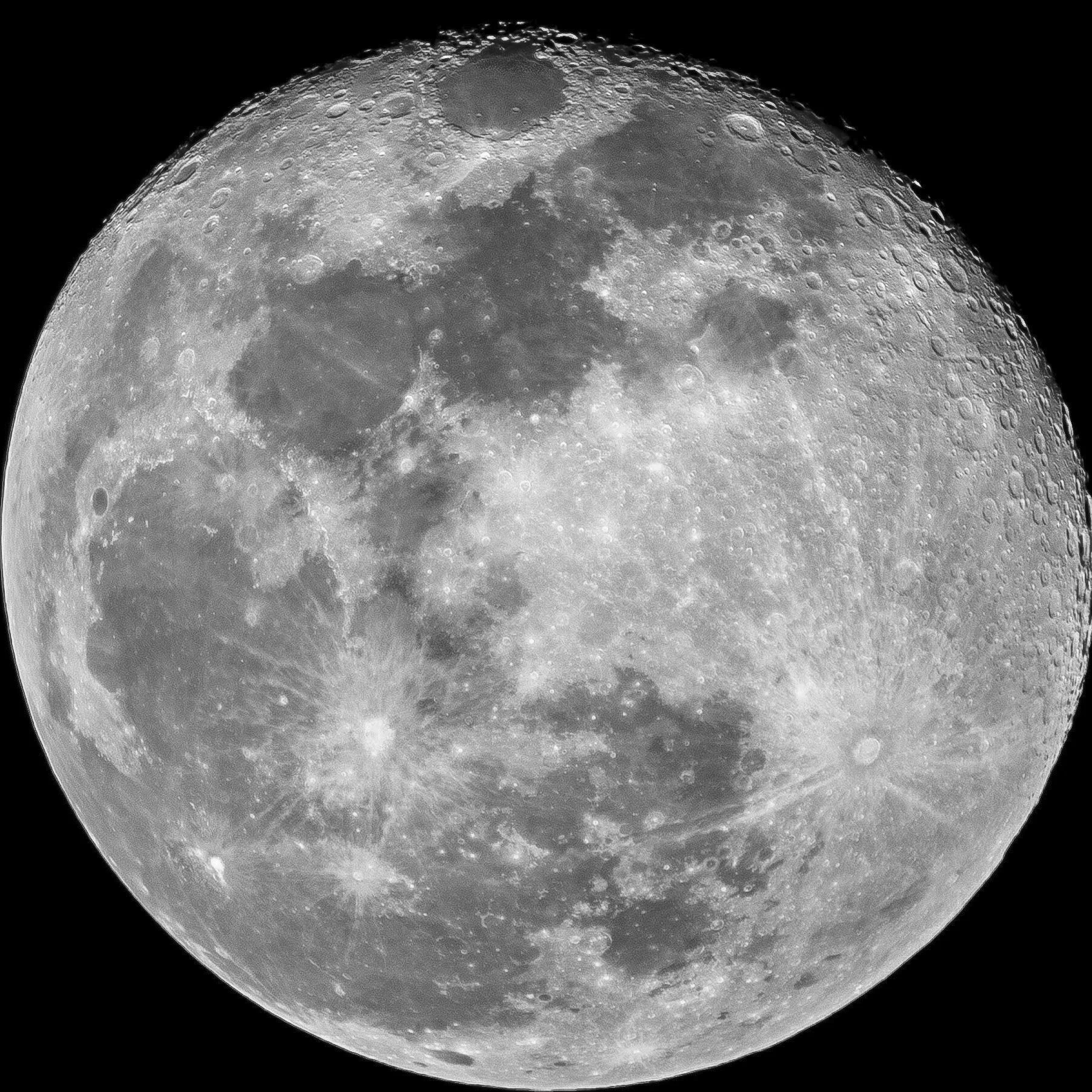 Close-up photograph of the moon with its cratered surface visible.