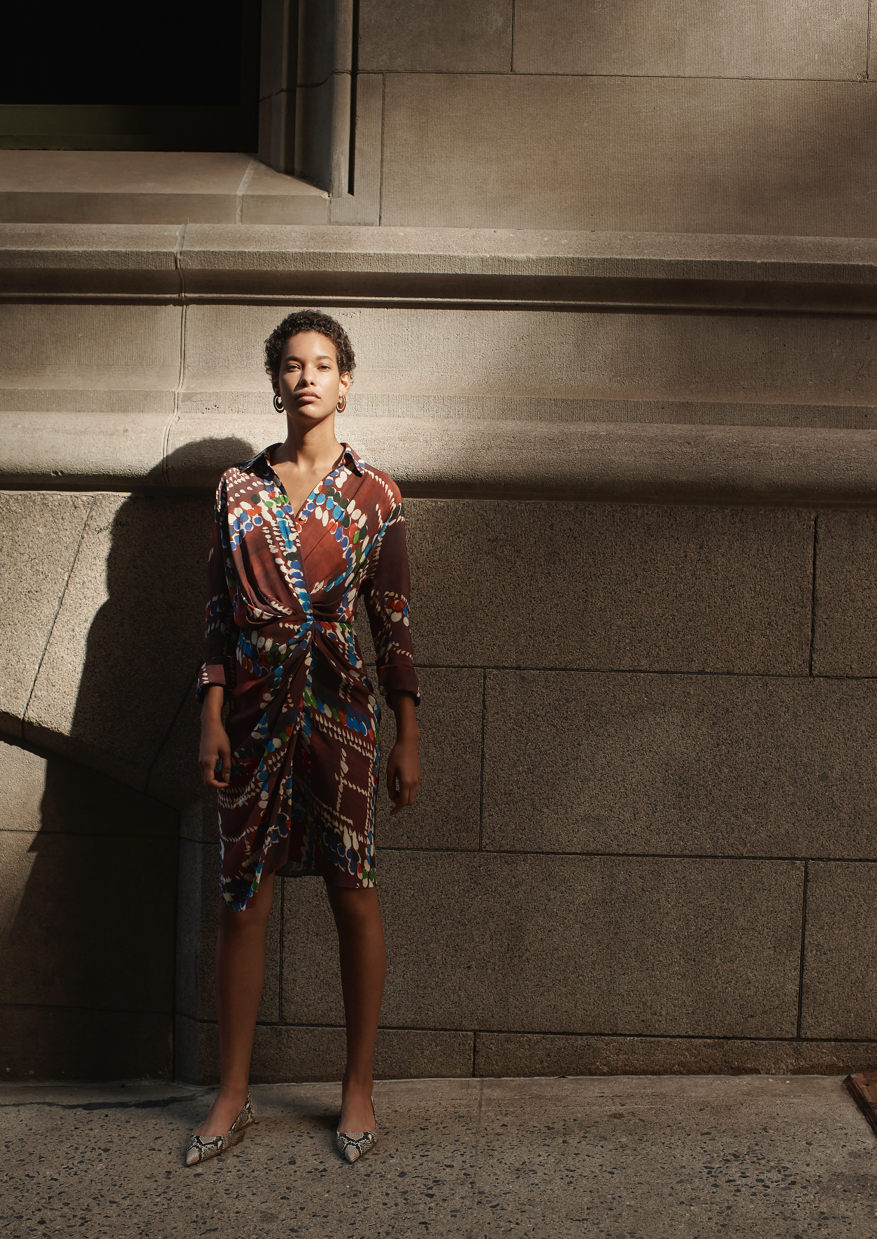 Fashion campaign street style with dramatic lighting featuring creative and art direction for women's luxury brand