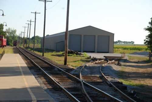 With the building completed, the track begins to be extended to the waiting doors.