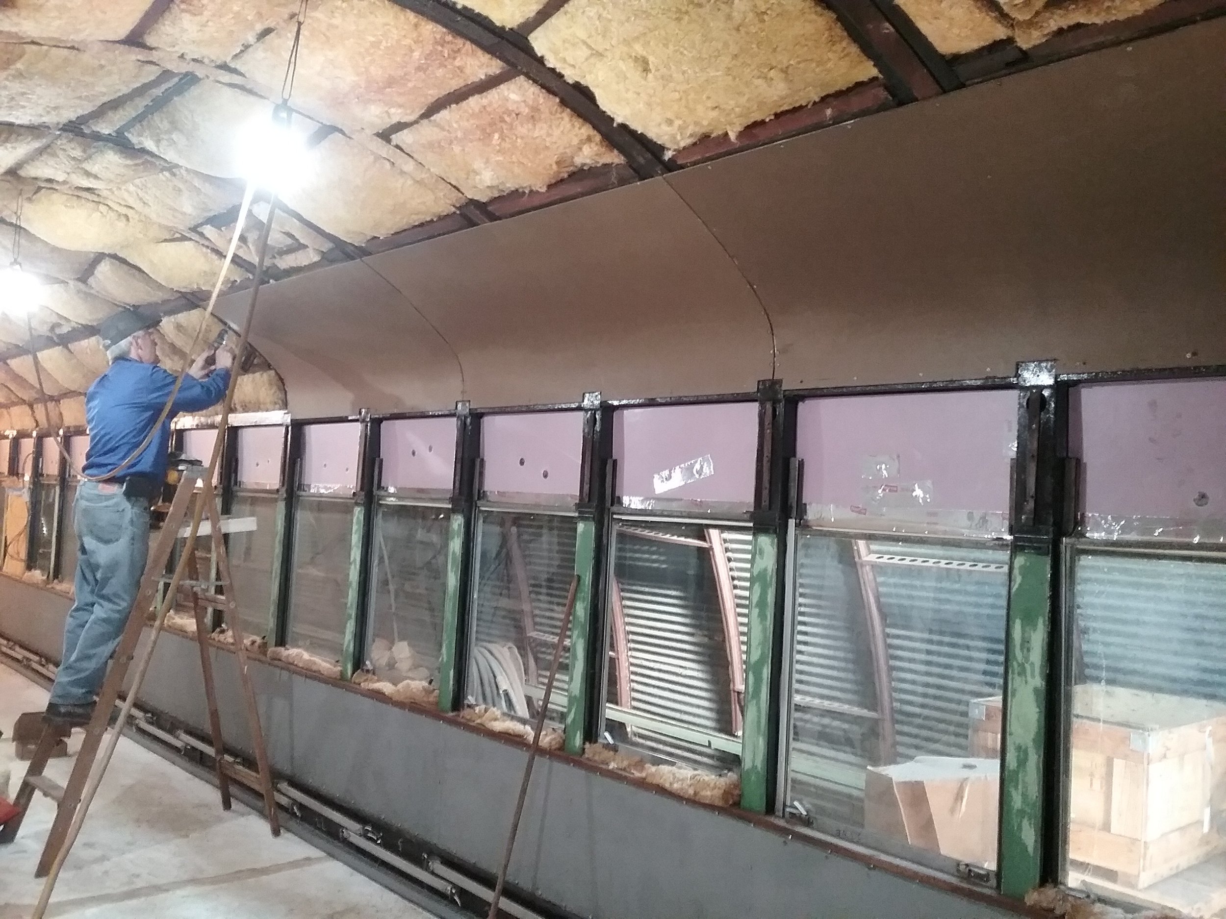  Ceiling panels continue above re-installed windows.  