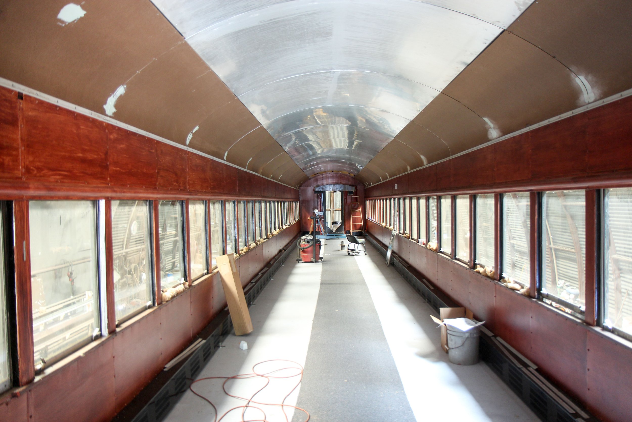  Back inside the car, all the new panels have been installed and repainted and the car awaits installation of the seats and grab bars.  