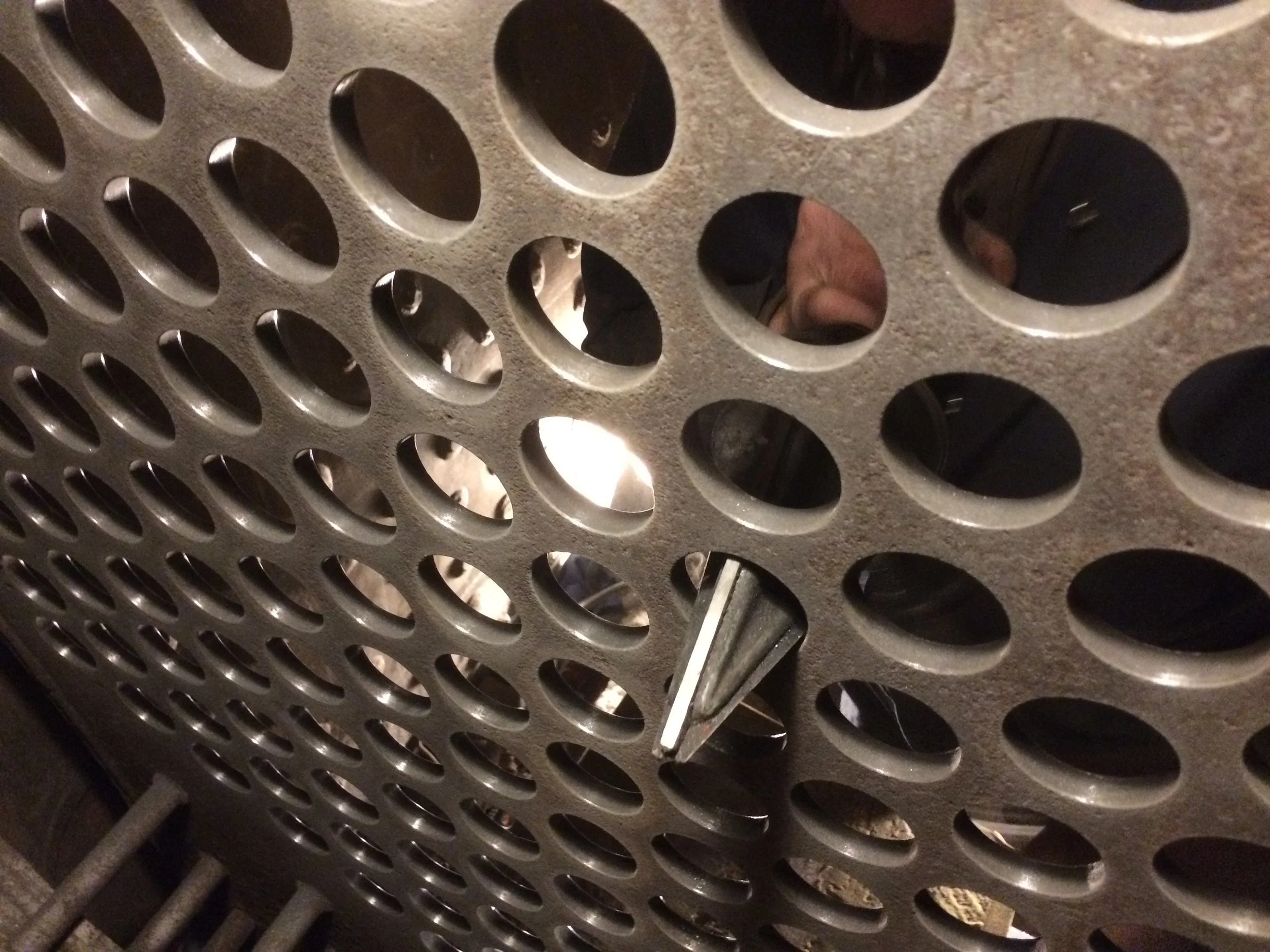  Once the inspection has determined that boiler shell thicknesses are acceptable, volunteers begin the reassembly process. This includes installing new boiler tubes, which requires preparing the mating surfaces in the tube sheet to receive the new tu