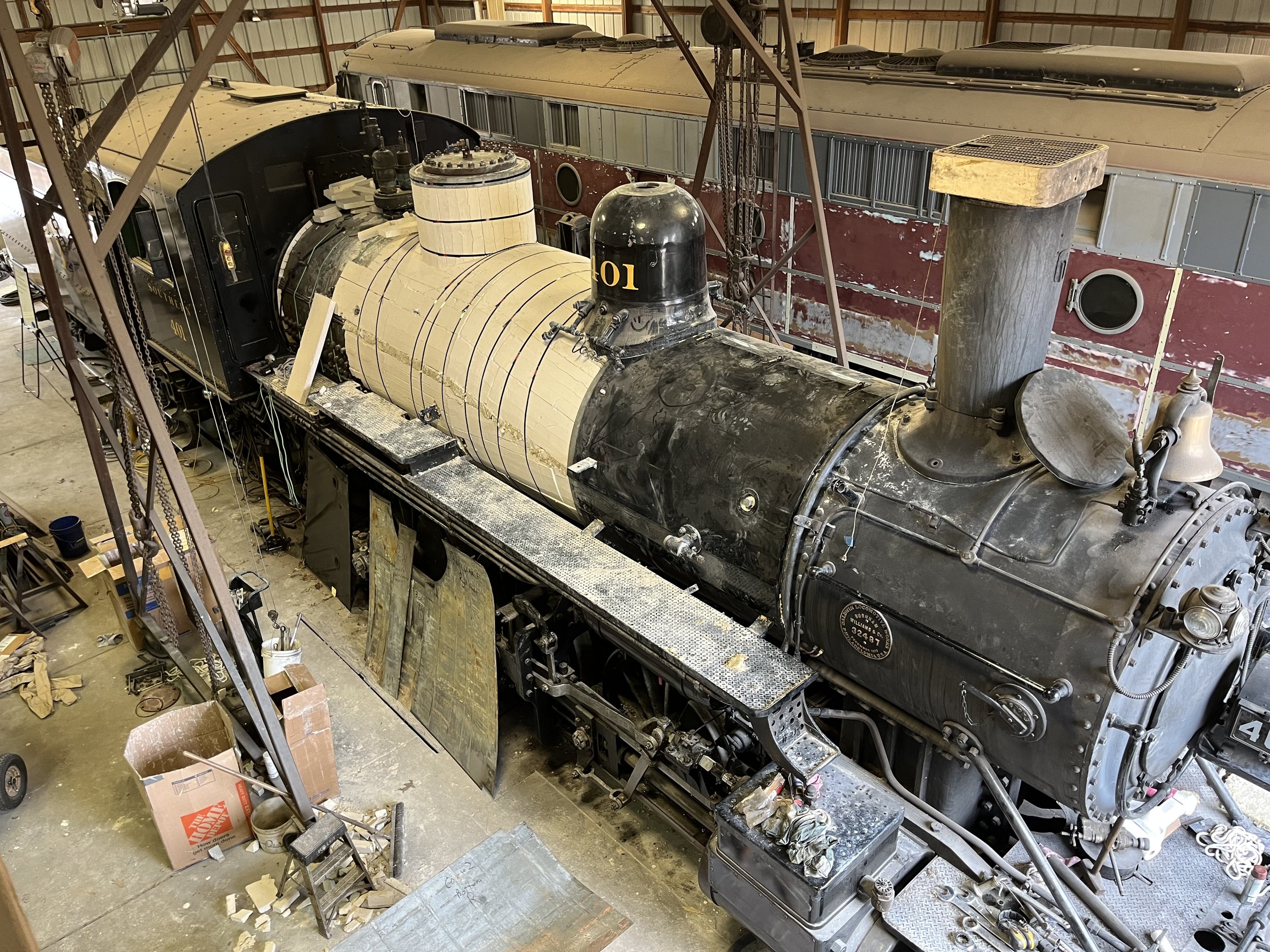  Once the work on the interior of the boiler is complete, volunteers begin to install new lagging insulation on the boiler. Once the lagging is installed, the jacketing will be reinstalled on top of the lagging.  