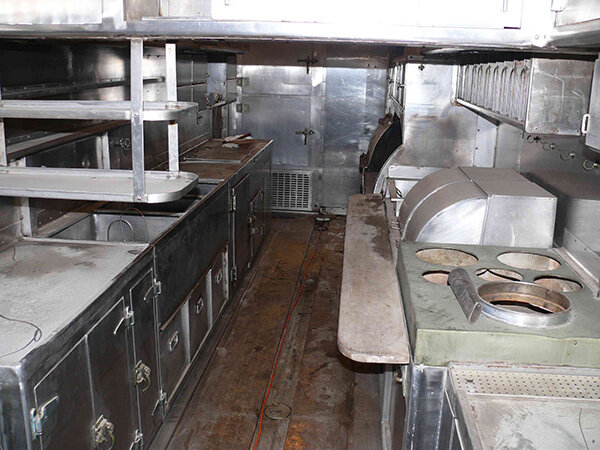 The kitchen is nearly intact. Missing only a freezer taken out for HVAC installation by its previous owner.
