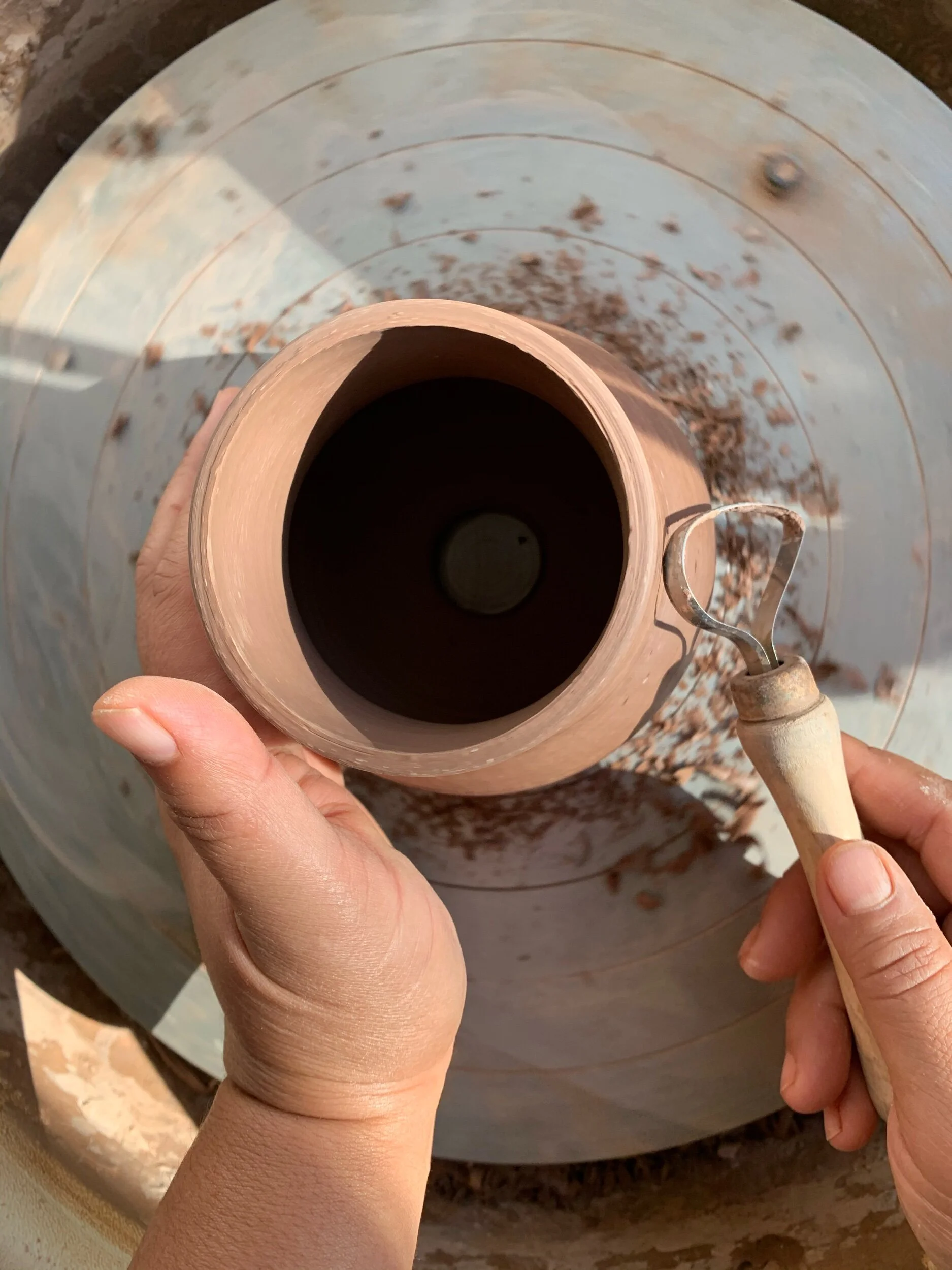 Birds eye view of trimming a brown cup