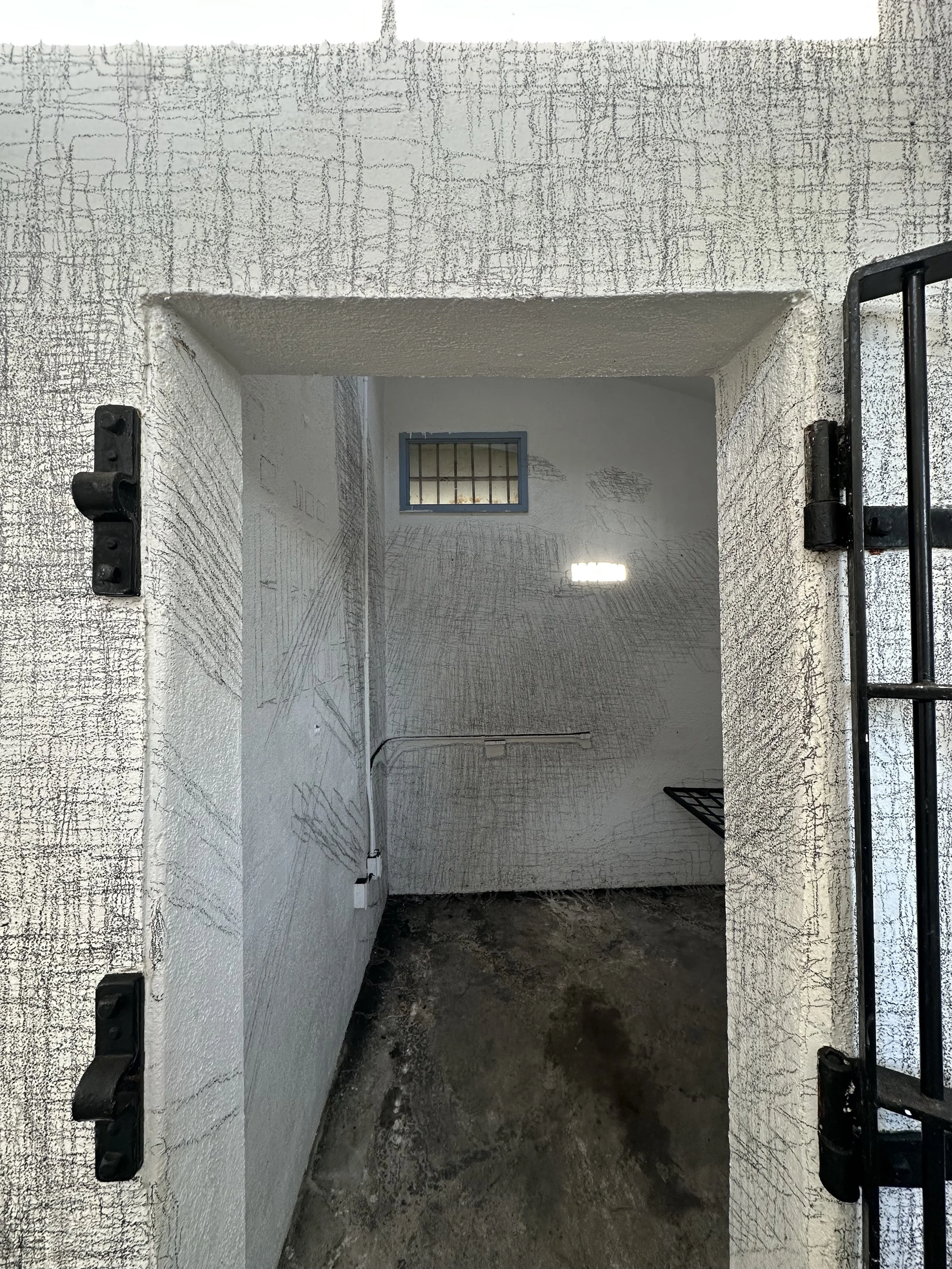 Holding On to Something Gone, 2026, Graphite on walls, sun, Dimensions variable