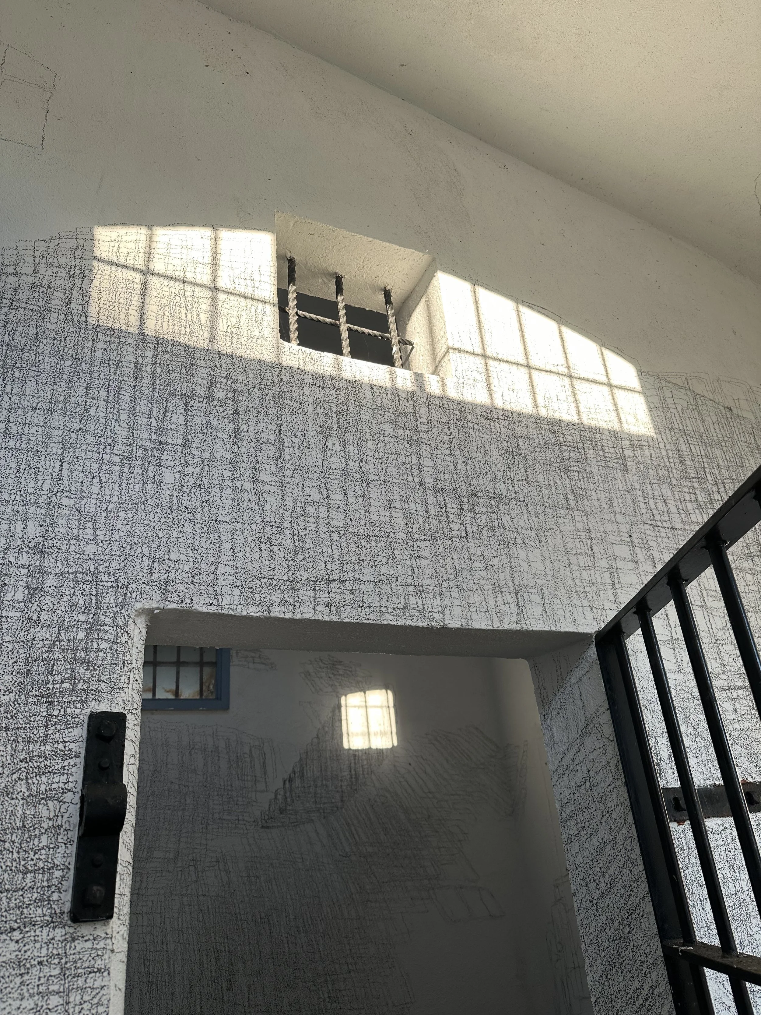 Holding On to Something Gone, 2026, Graphite on walls, sun, Dimensions variable