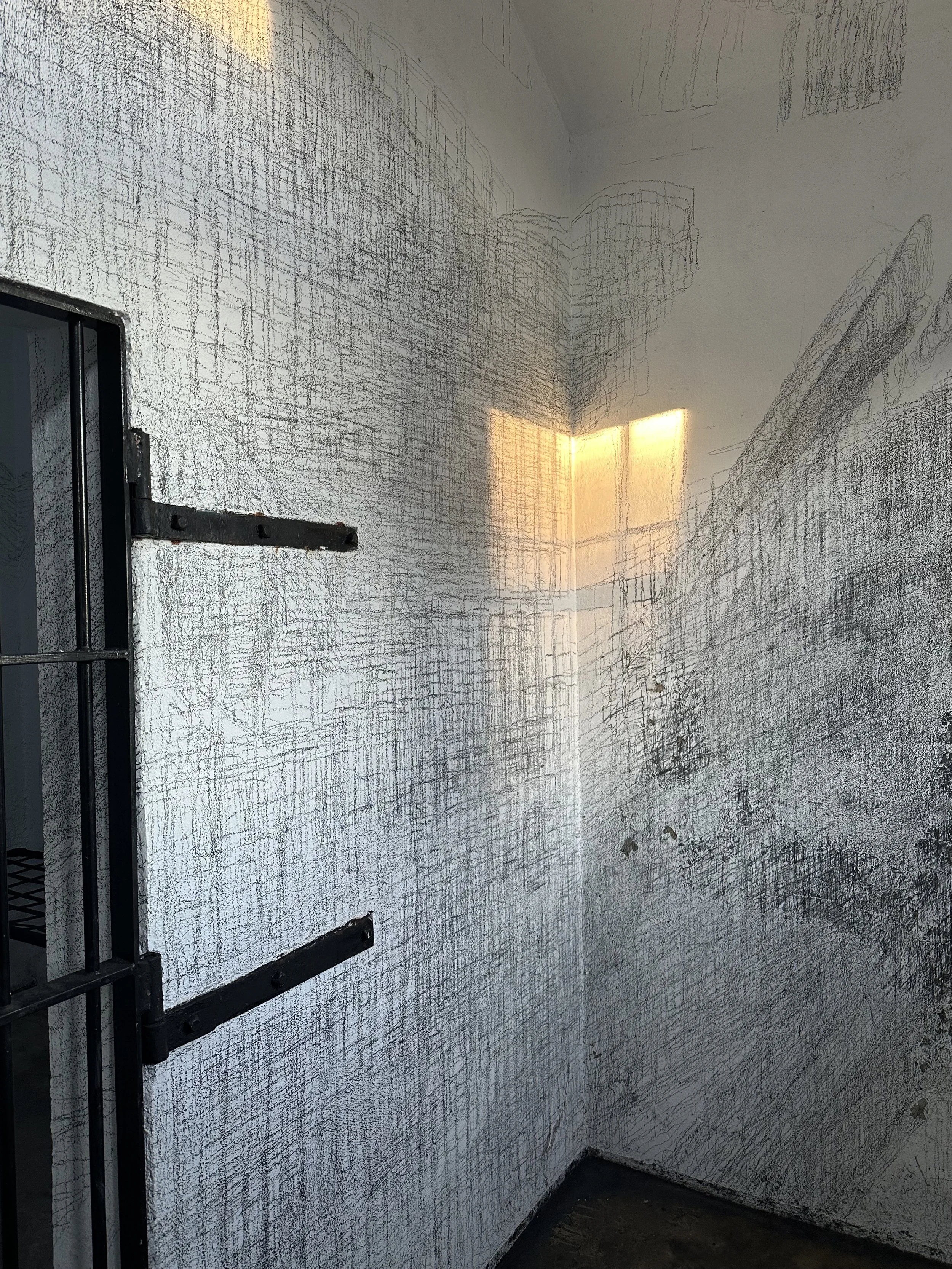 Holding On to Something Gone, 2026, Graphite on walls, sun, Dimensions variable