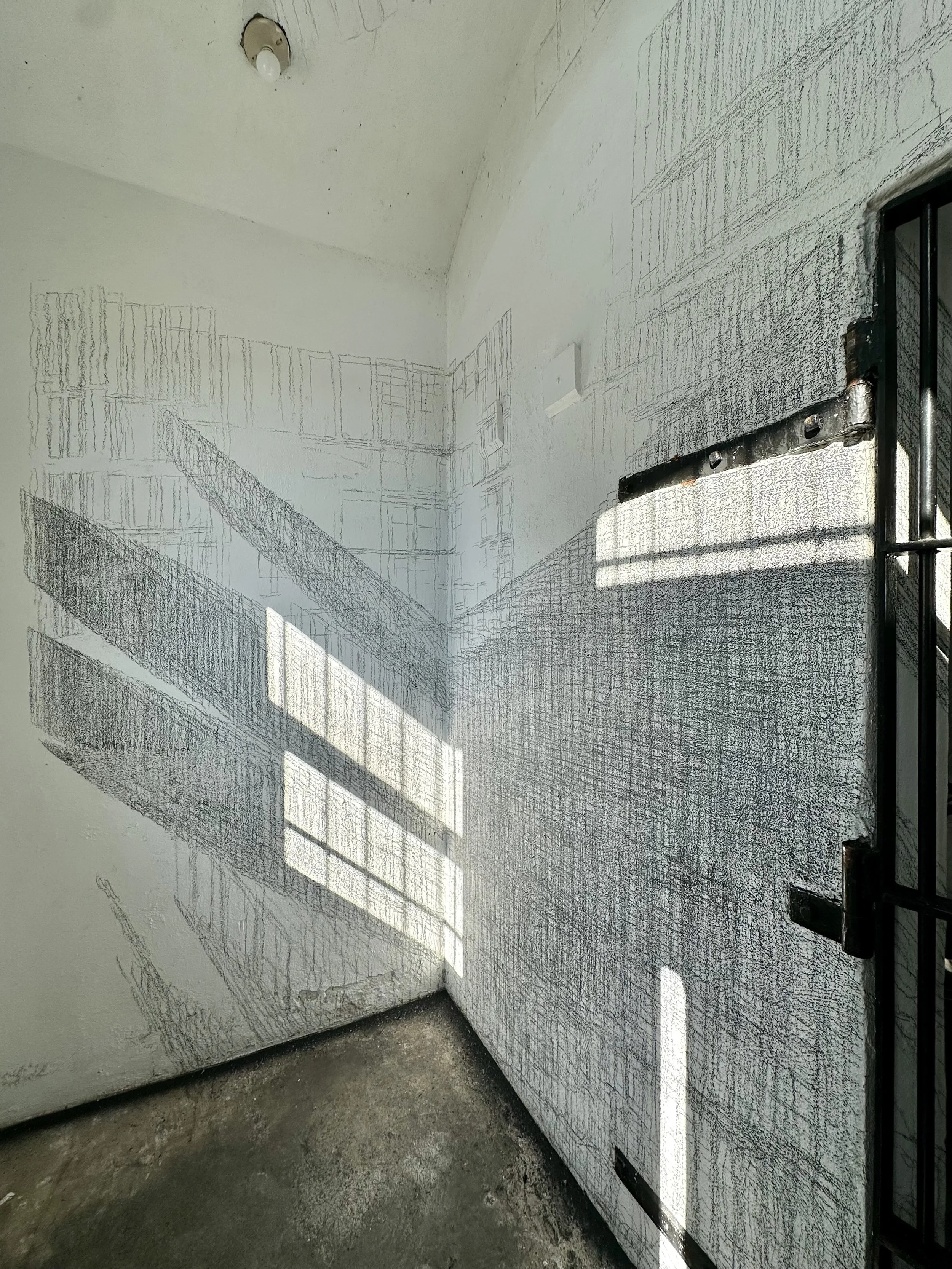 Holding On to Something Gone, 2026, Graphite on walls, sun, Dimensions variable