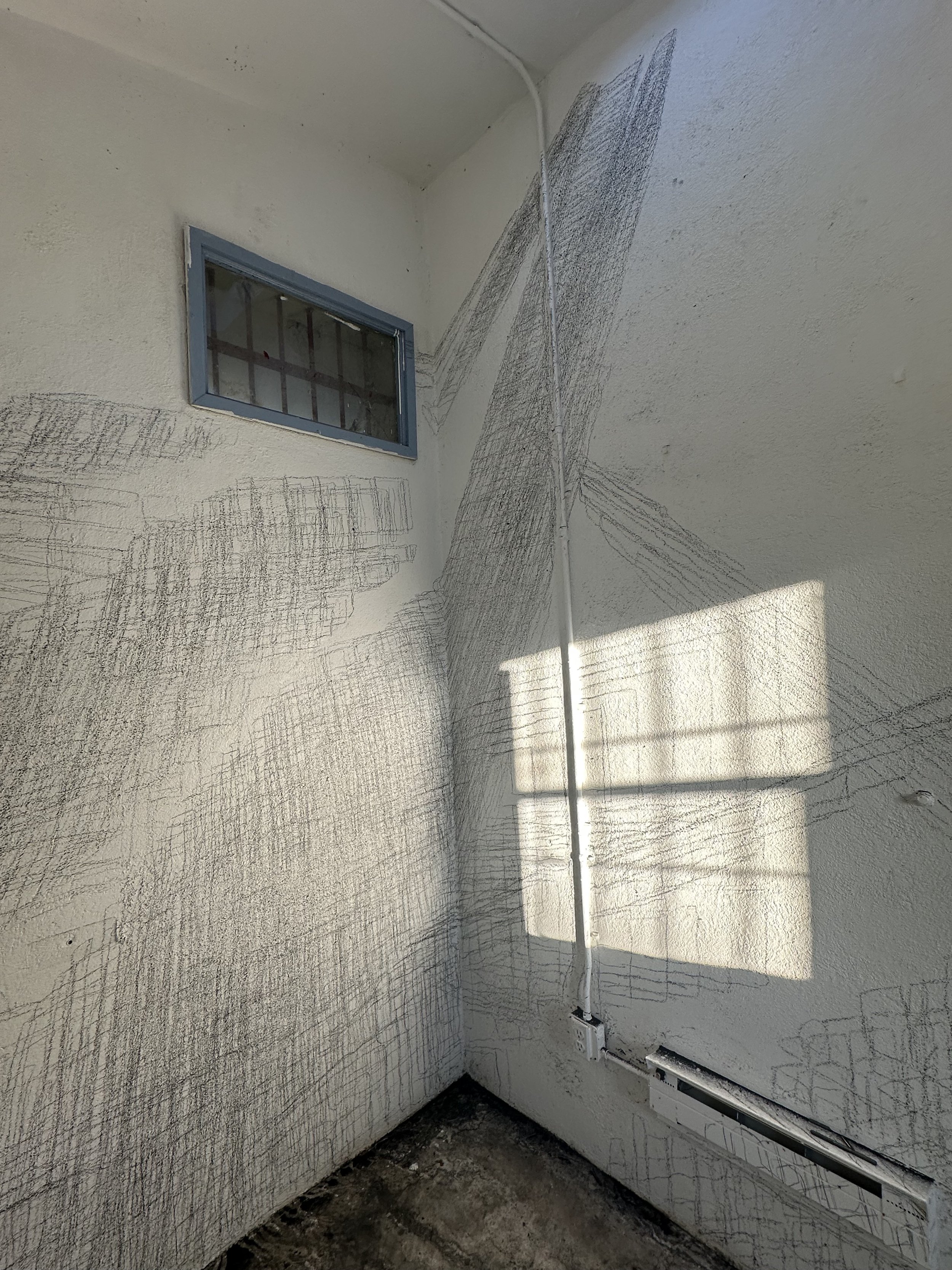Holding On to Something Gone, 2026, Graphite on walls, sun, Dimensions variable