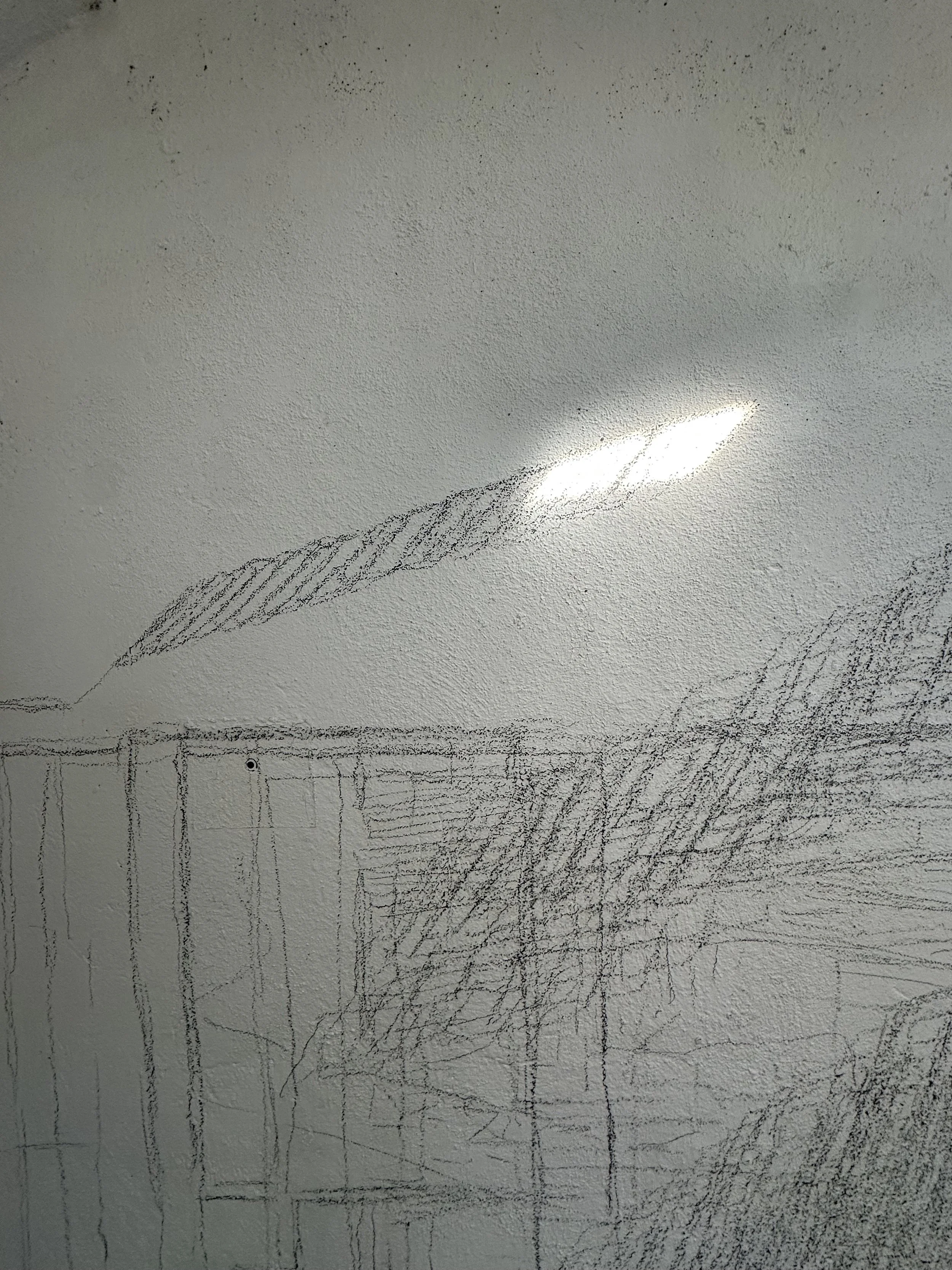 Holding On to Something Gone, 2026, Graphite on walls, sun, Dimensions variable