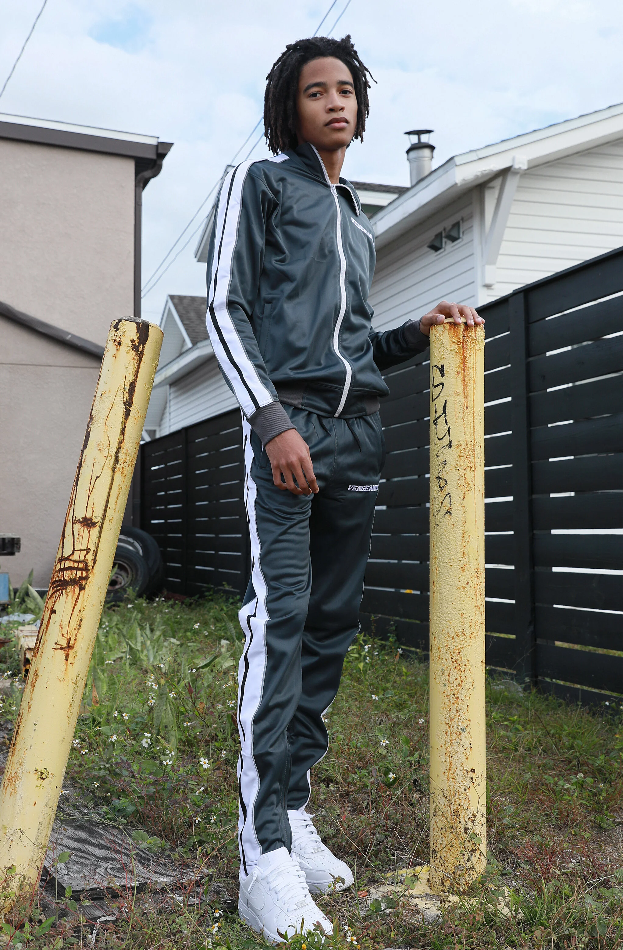 High Fashion Male Model wearing gray tracksuit in street photography.  Urban Location in Orlando Fl, Mills Ave