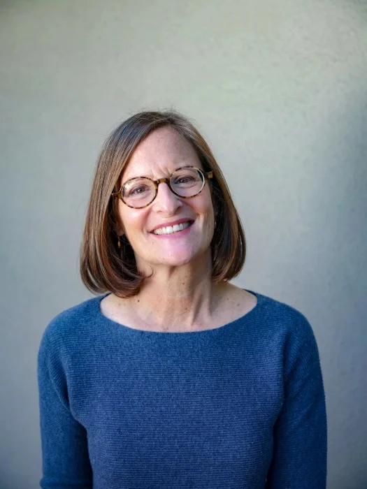 A Headshot of Amy S Albert, smiling.