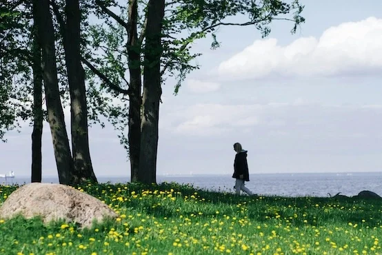 Woman walking by water