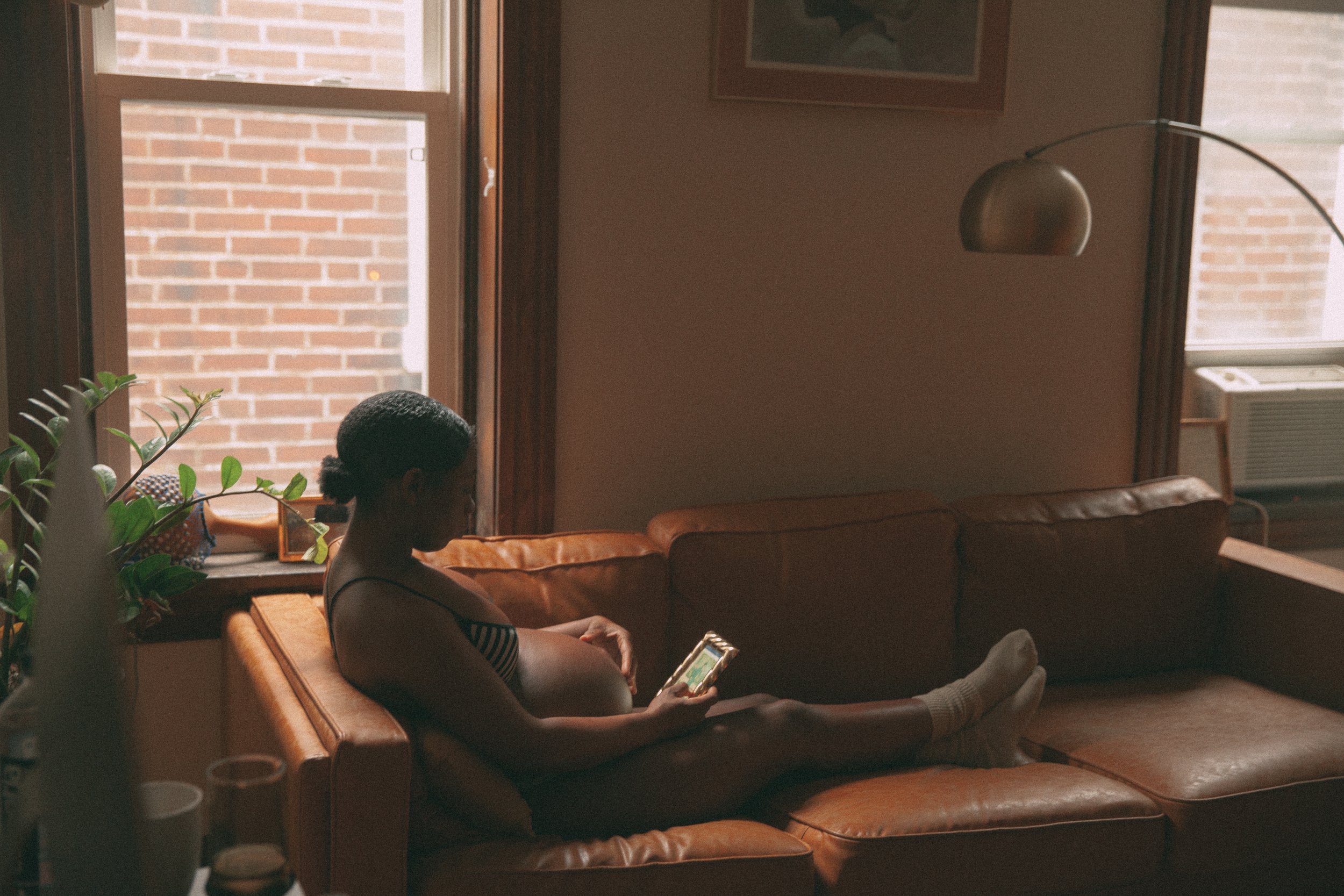 Jamaica changes positioning of her hands and then peers past the photo of her mother to say, "I wish she were here."