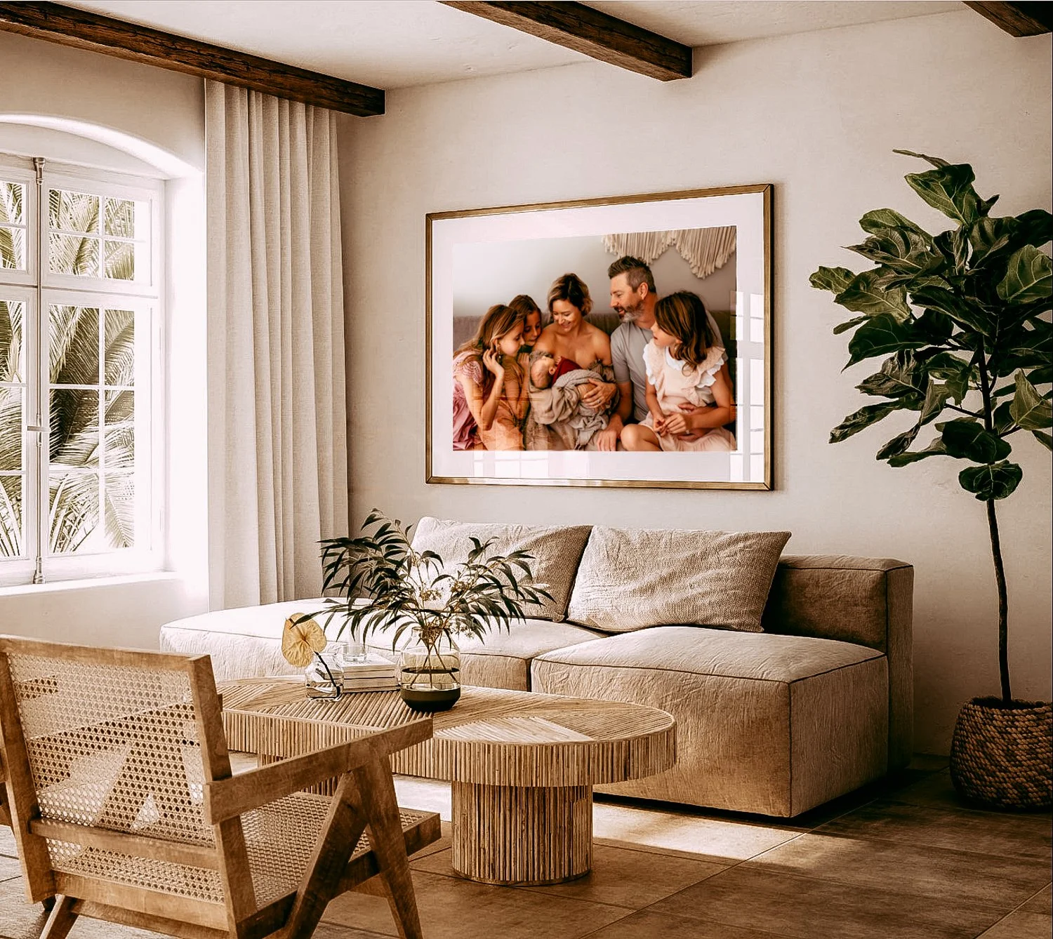 Living room with beige furniture, indoor plant, and framed family photo on wall.