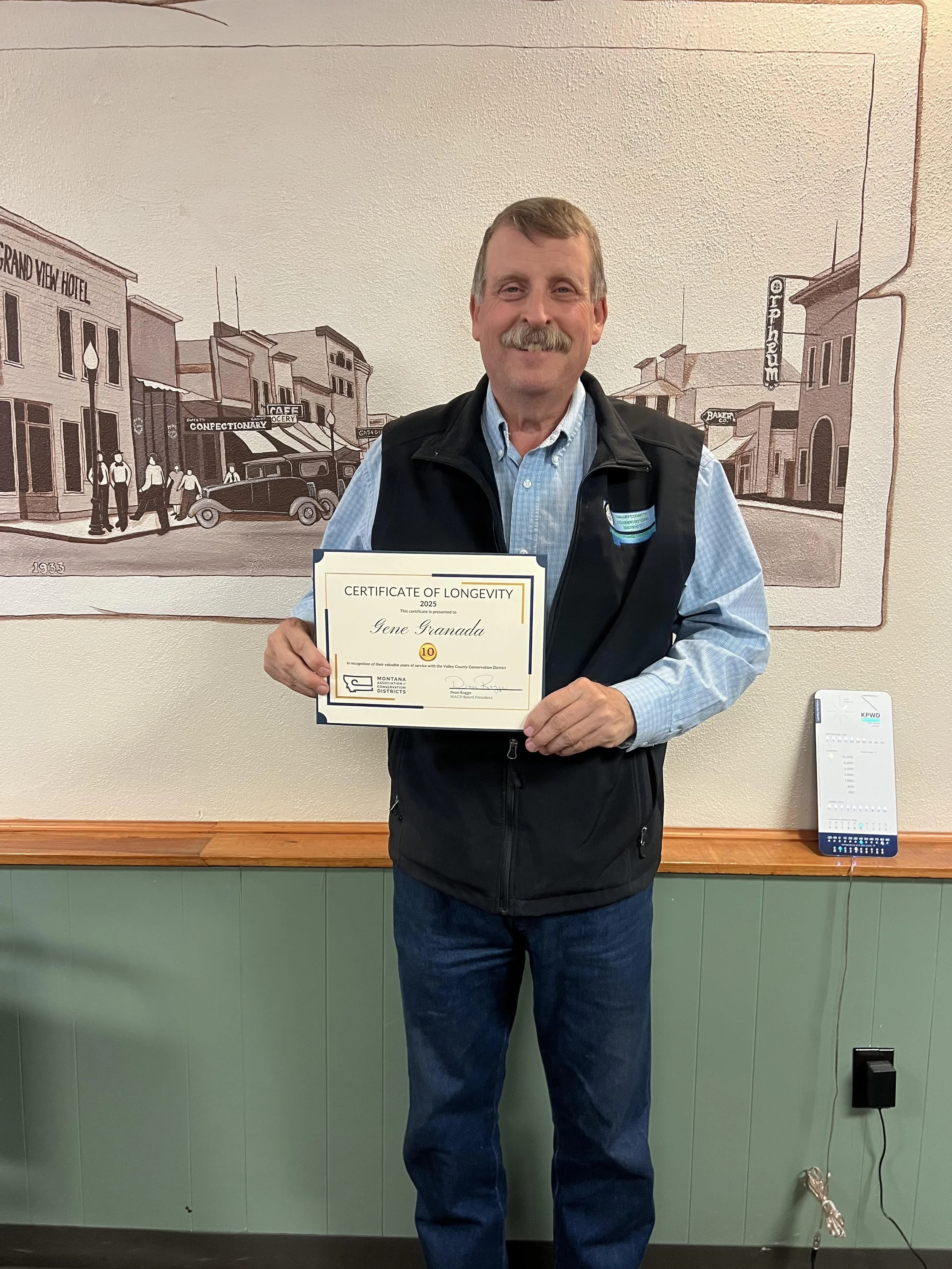 Chairman Gene Granada with 10 year Longevity Award