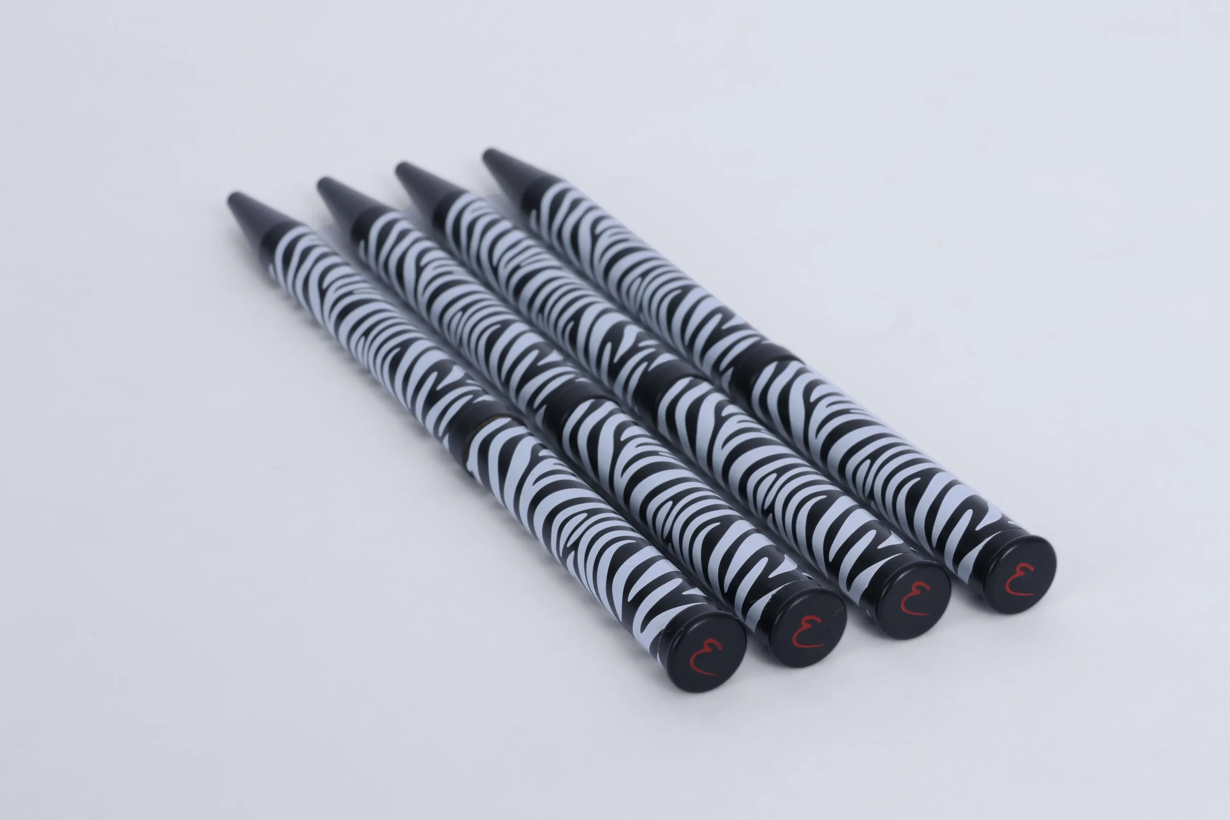 EMP - pen-twist-action-zebra-pattern-matte-black-accessories-branded-logo-cap-premium-packaging-product-creation-custom-emporium-hotel-hospitality-design-develop-deliver-consultantspr.com-2-re.jpg
