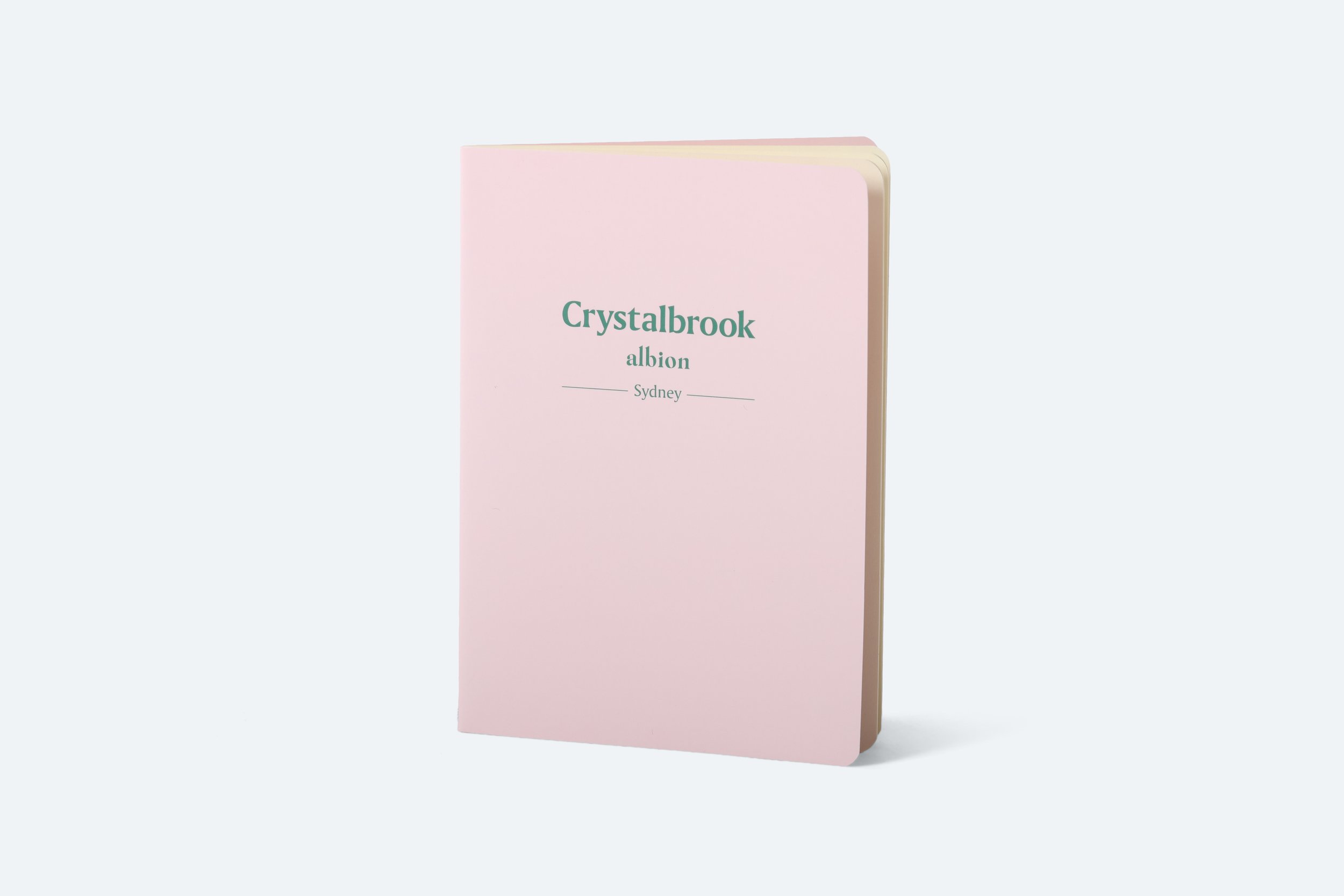 CBC050 - notebook-a6-paper-150gsm-pink-PMS691-outside-12-pages-spine-stitch-little-albion-branded-green-PMS342-logo-url-premium-hotel-product-specialists-creation-custom-design-develop-deliver-consultantspr-final-1