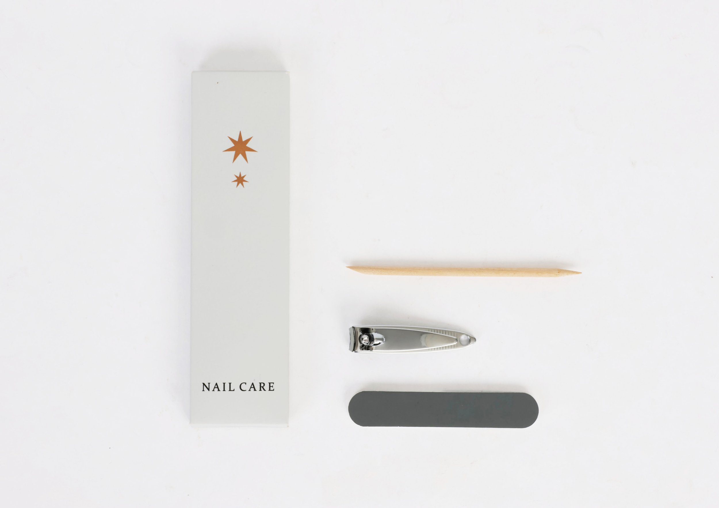 CAP020 - boxed-nail-care-contains-nail-clipper-cuticle-stick-emery-board-dry-amenities-eco-friendly-serated-box-no-plastic-pms427u-copper-foil-stamp-consultantspr.com-design copy.jpg