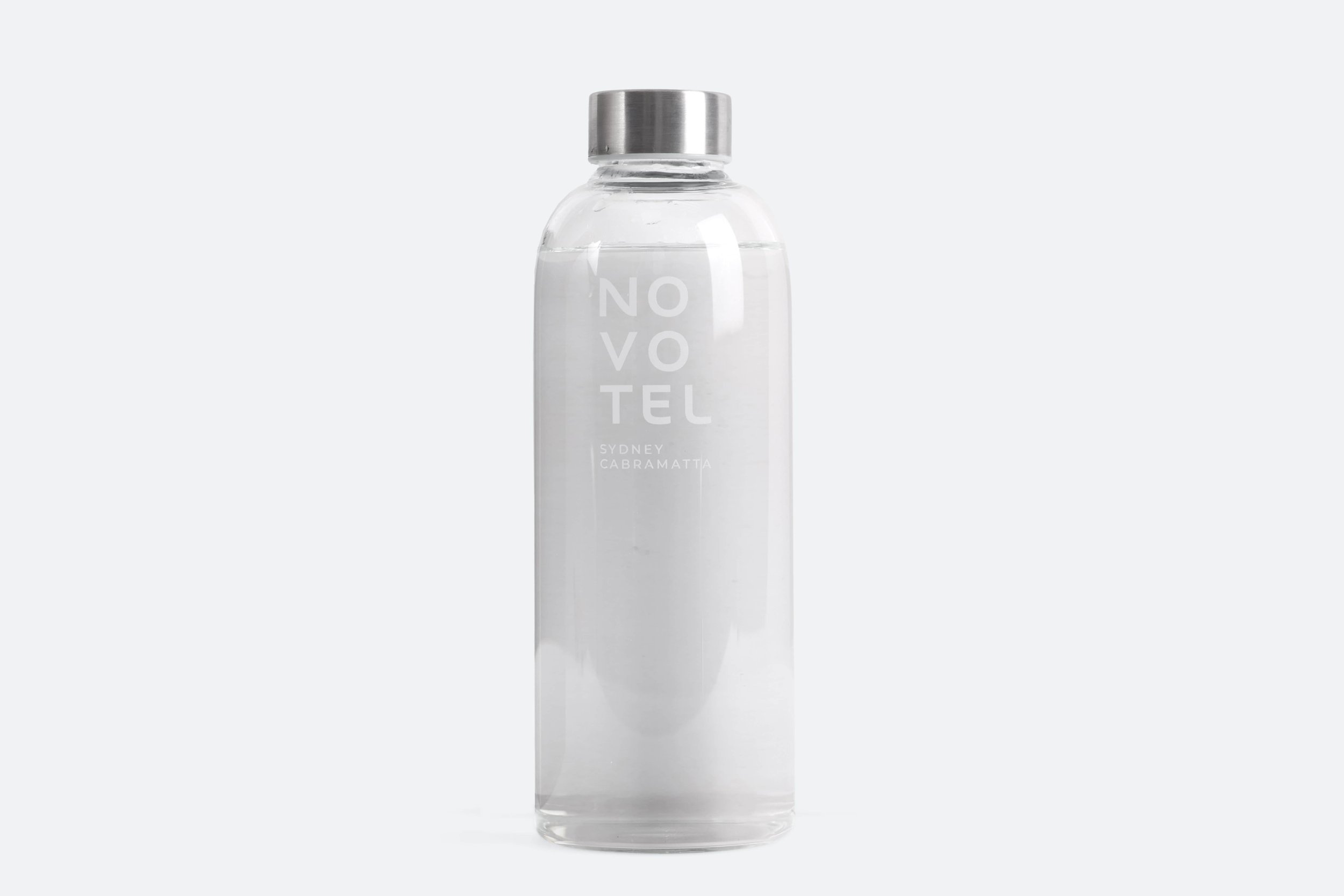 NOVO006 - bottle-glass-clear-cylinder-shape-silver-metal-screw-cap-etched-novotel-logo-sydney-cabramatta-premium-hotel-product-specialists-creation-custom-design-develop-deliver-consultantspr-v1-sample-1.JPG