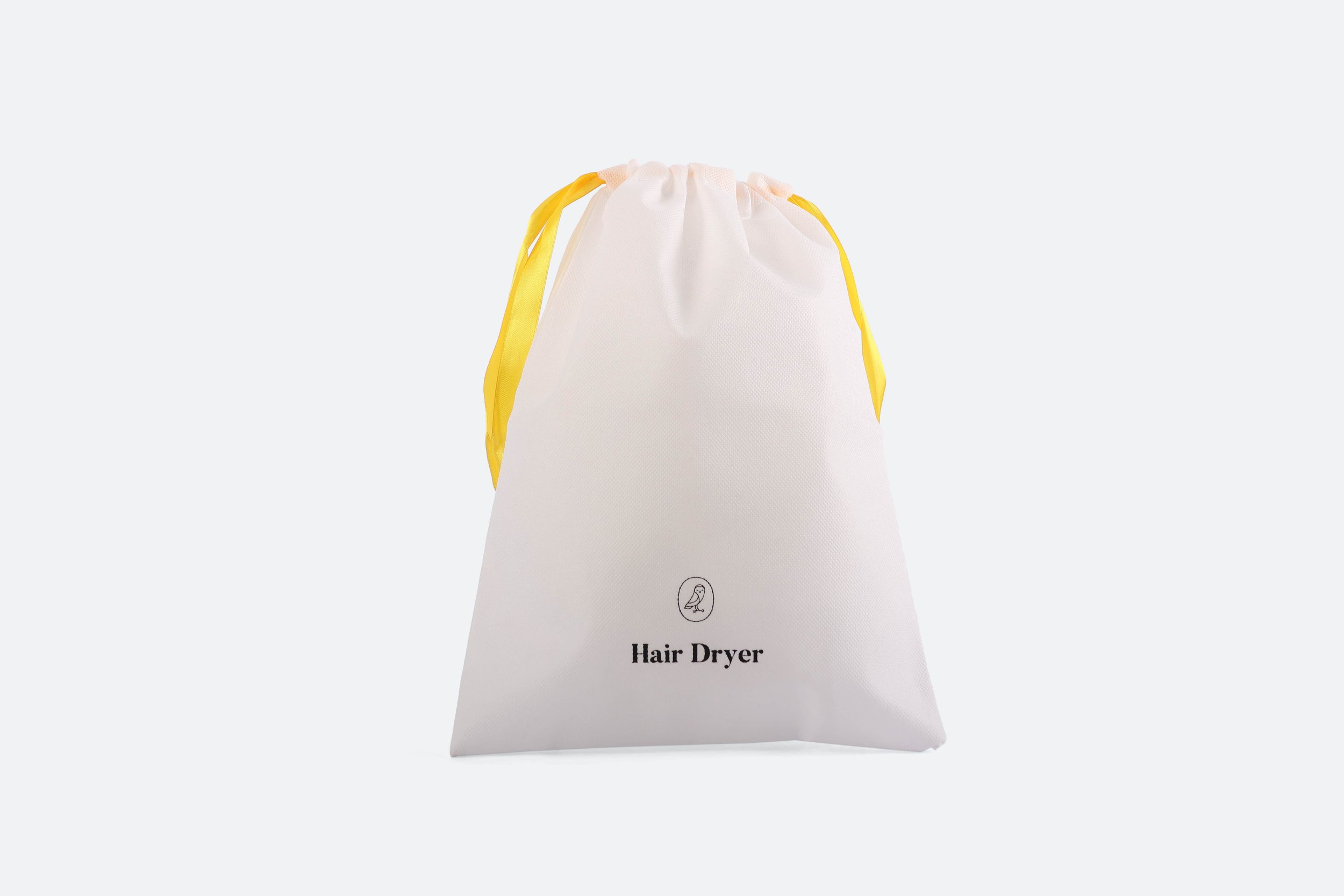 VOCO022 - bag-hair-dryer-non-woven-80-gsm-white-yellow-drawstring-black-logo-printed-premium-hotel-product-specialists-creation-custom-design-develop-deliver-consultantspr-final-1