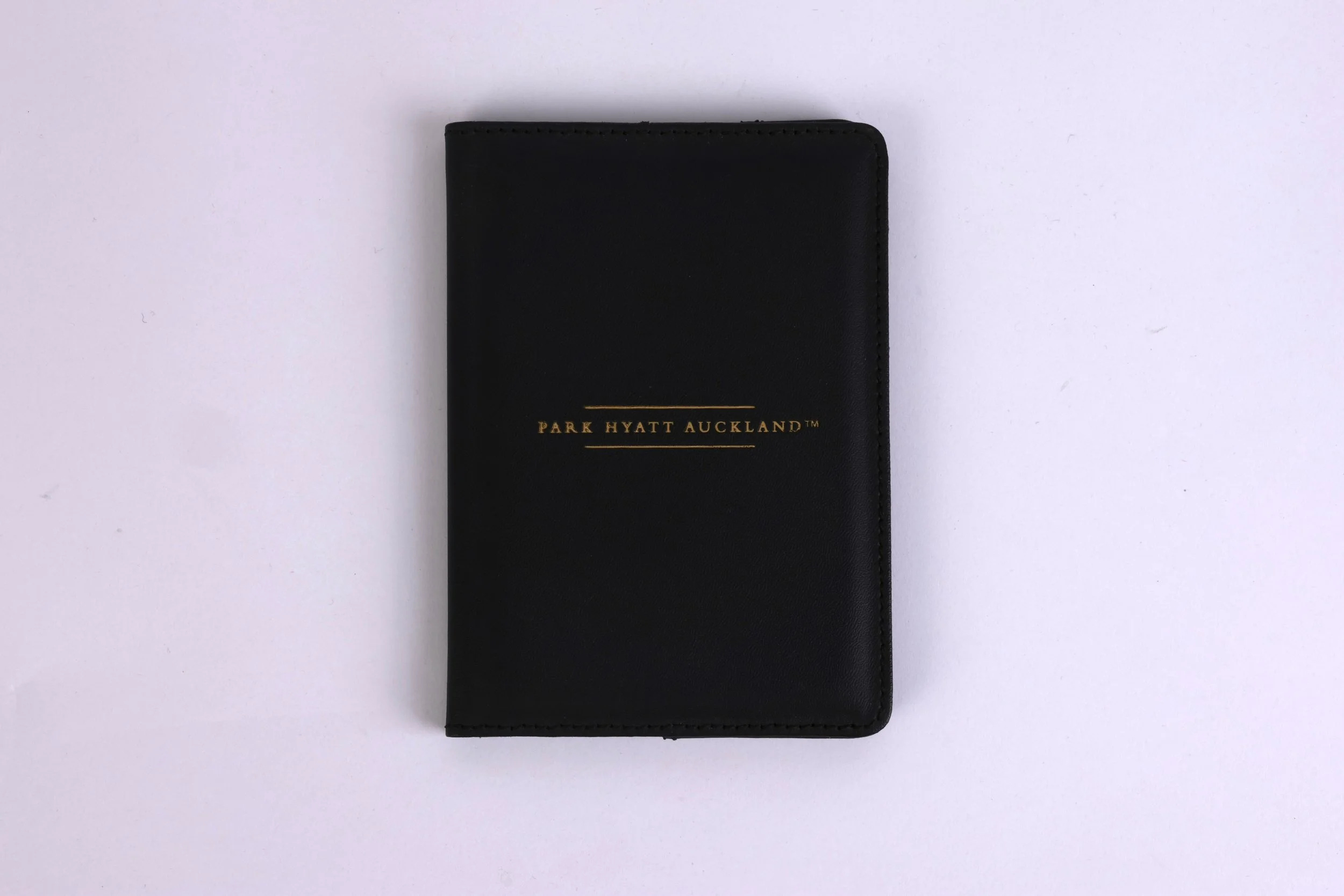 PHA019 - passport-holder-debossed-leather-black-gold-final-1.JPG