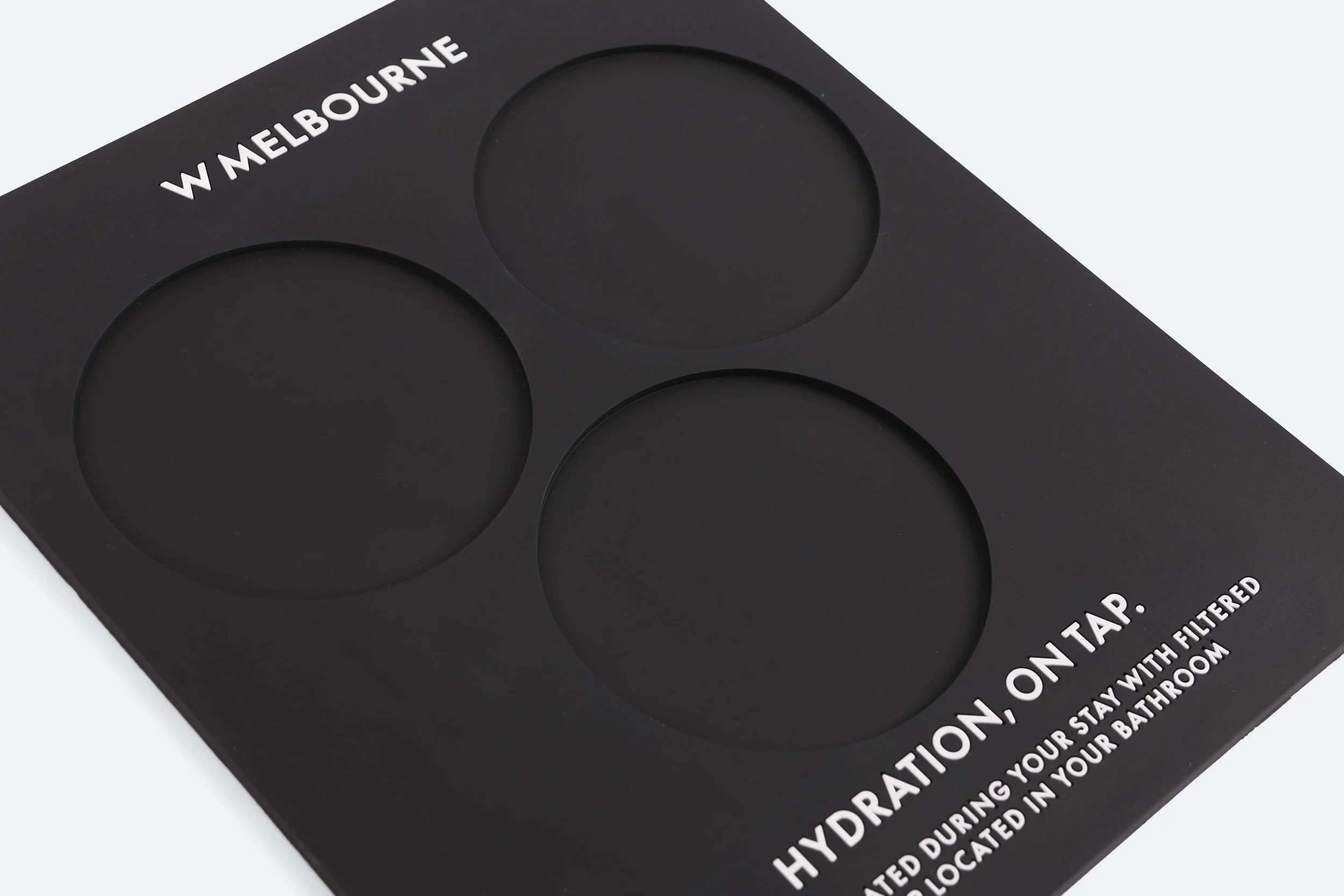 WHO104 - carafe-placemat-silicone-black-embossed-text-branded-size-square-shape-indented-premium-hotel-product-specialists-creation-custom-design-develop-deliver-consultantspr-sample-6.JPG