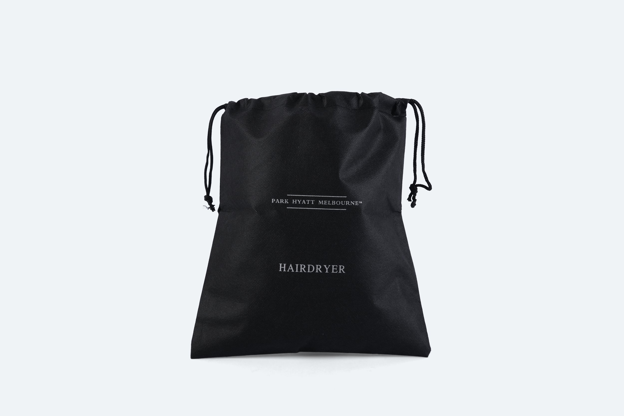 PHM026 - hairdryer-bag-black-nonwoven-drawstring-white-print-branded-premium-hotel-product-specialists-creation-custom-design-develop-deliver-consultantspr-final-1.JPG