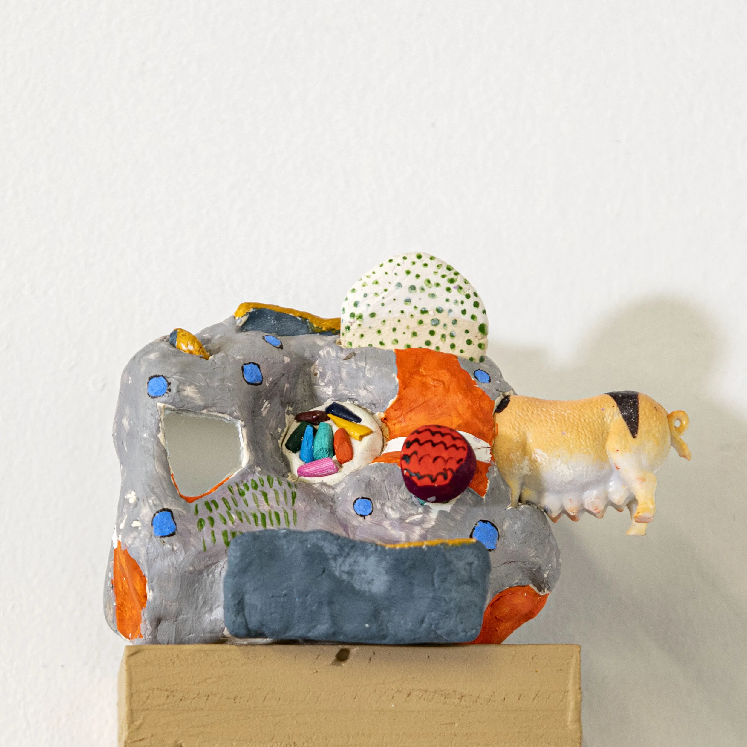 Mountain Of Hope, 2021
HxWxD 2.5x3.3x1.7in
acrylic, gouache, mirror, pencil lead, plastic pig on clay