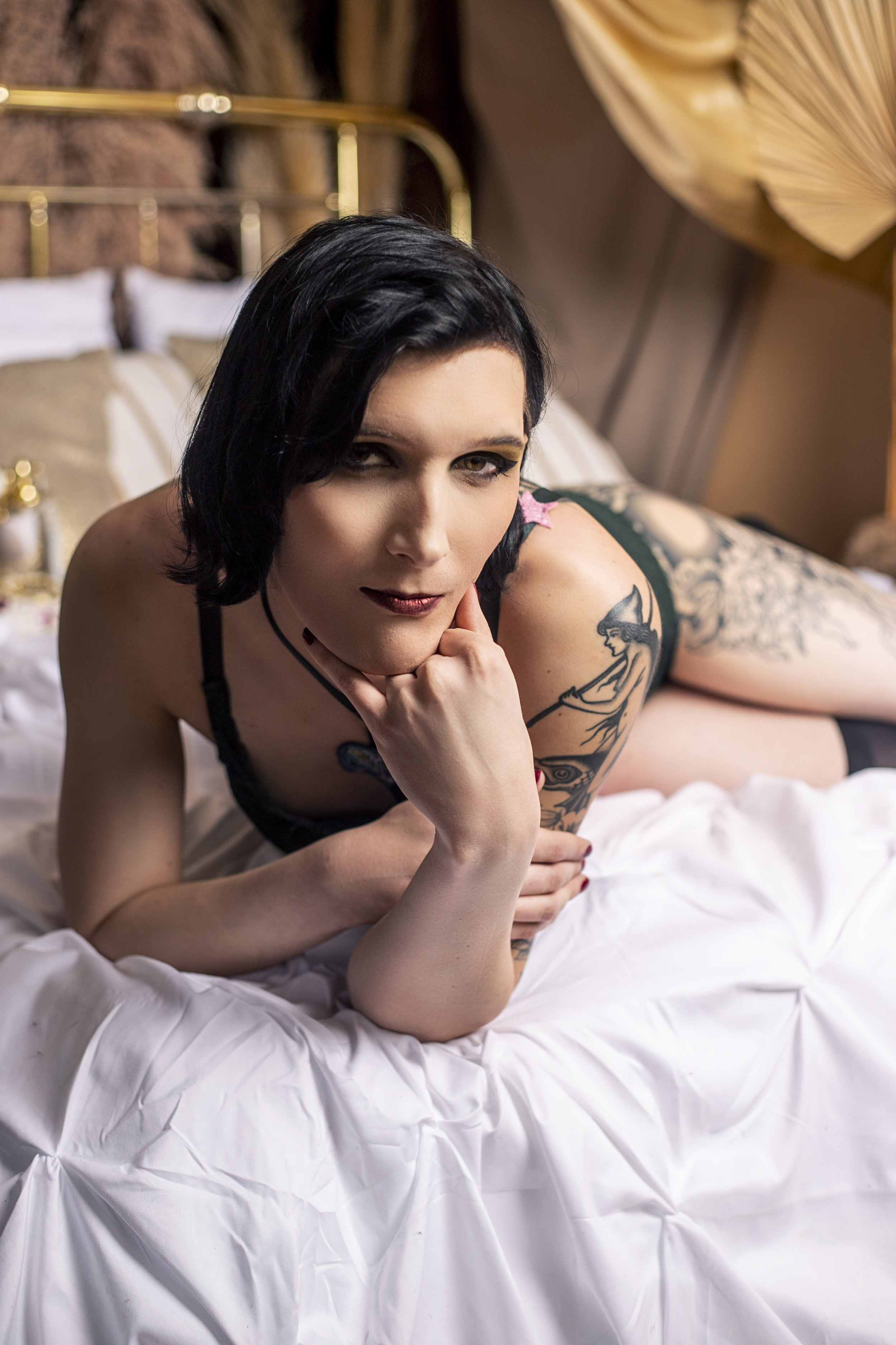Sensual woman in lingerie lounging on a bed