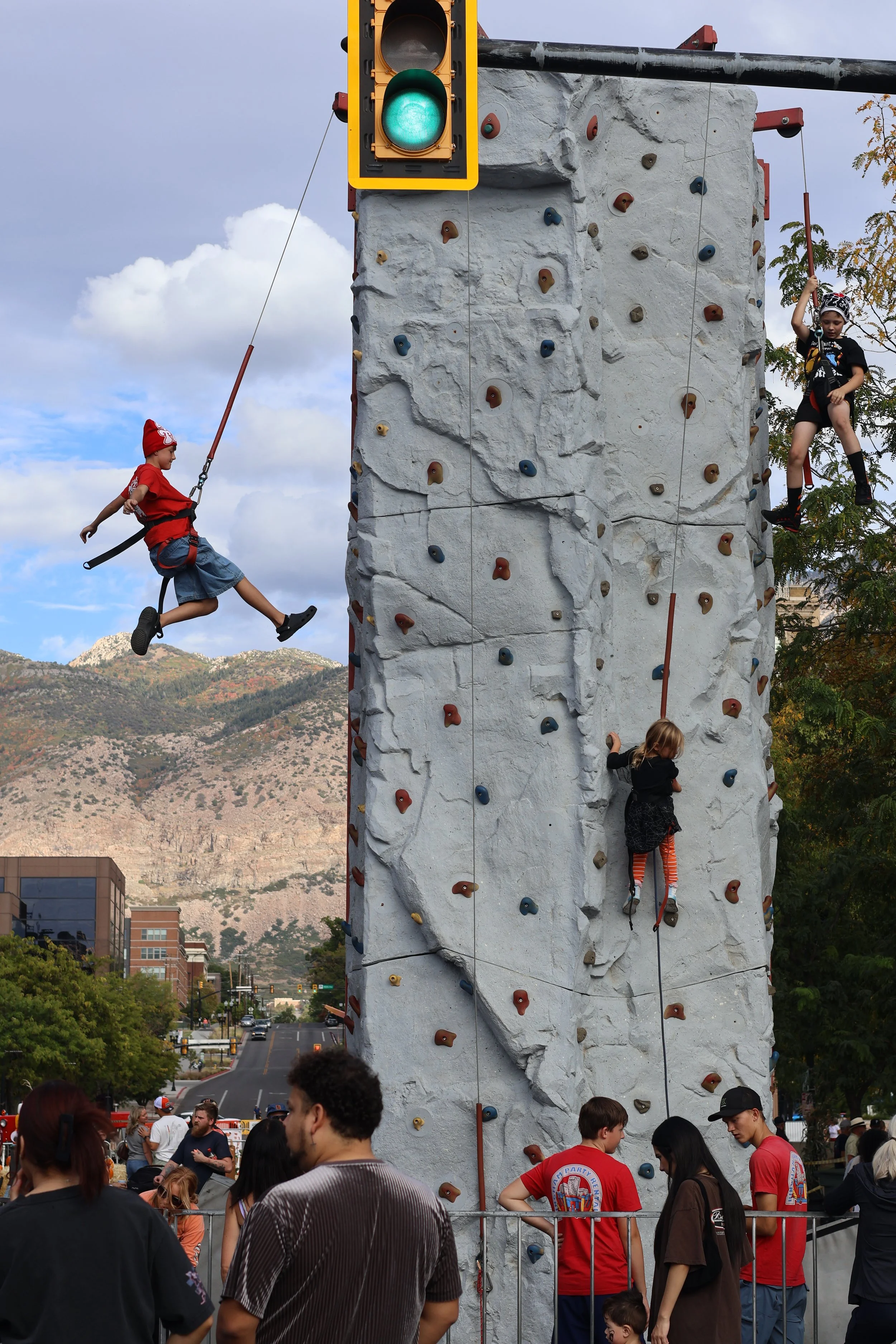  Attendees of all ages were lined up to climb the rock wall throughout the day. 