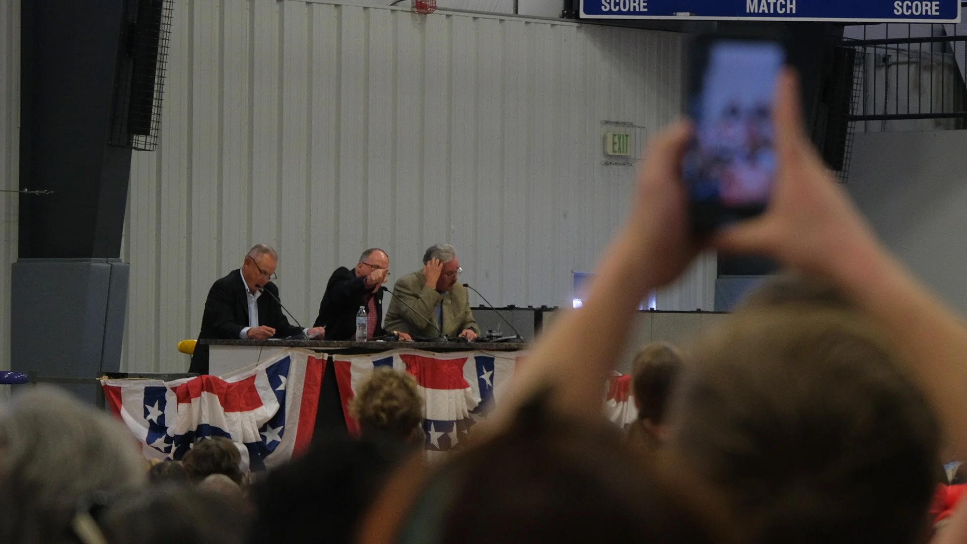  Commissioner Tyler Vincint shouts back to a rowdy crowd moments after Commissioner Boyd Bingham told attendees to “grow up.”