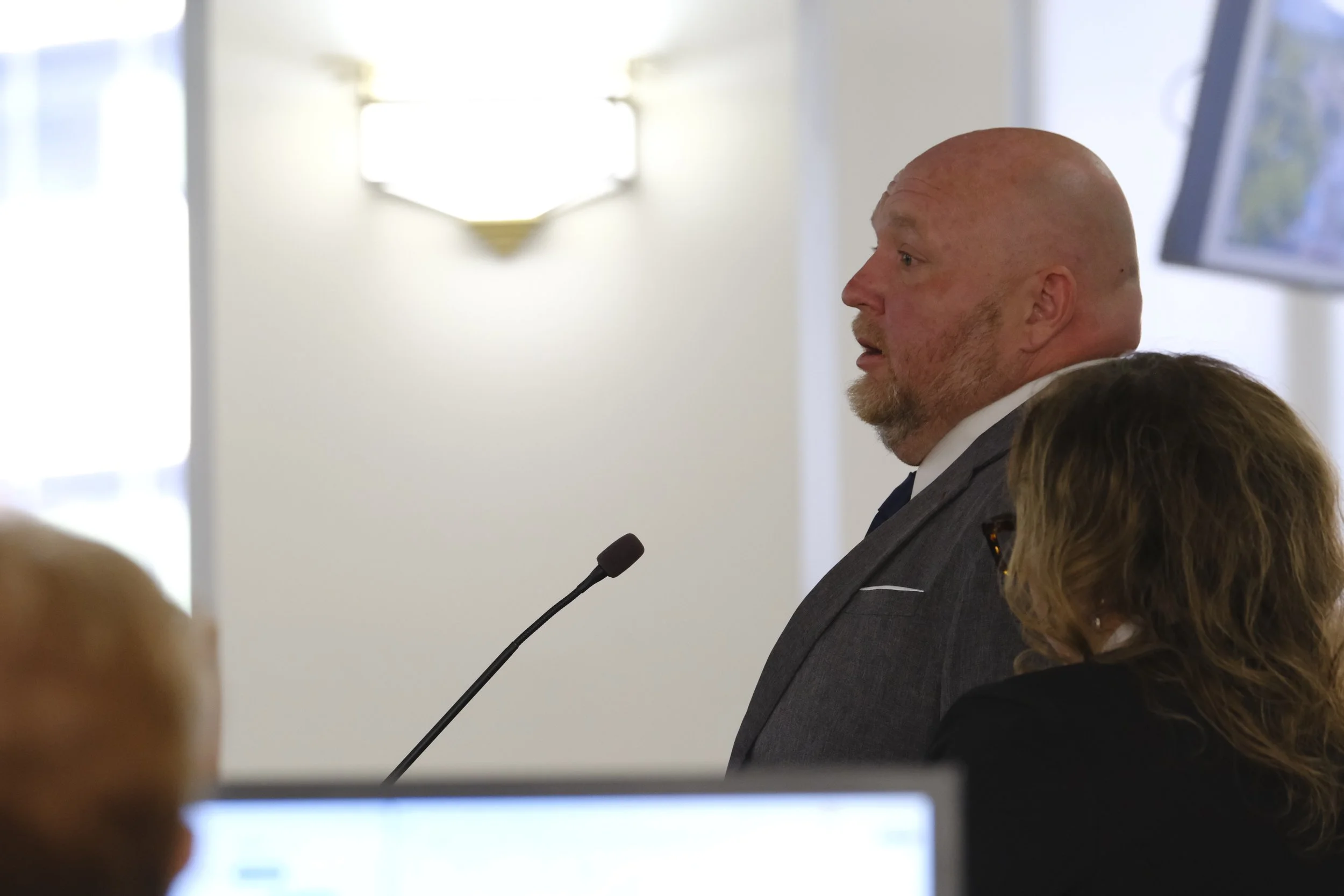 Emil Vargason and Lisa Stout answer questions from council members during a presentation on the paid parking system.