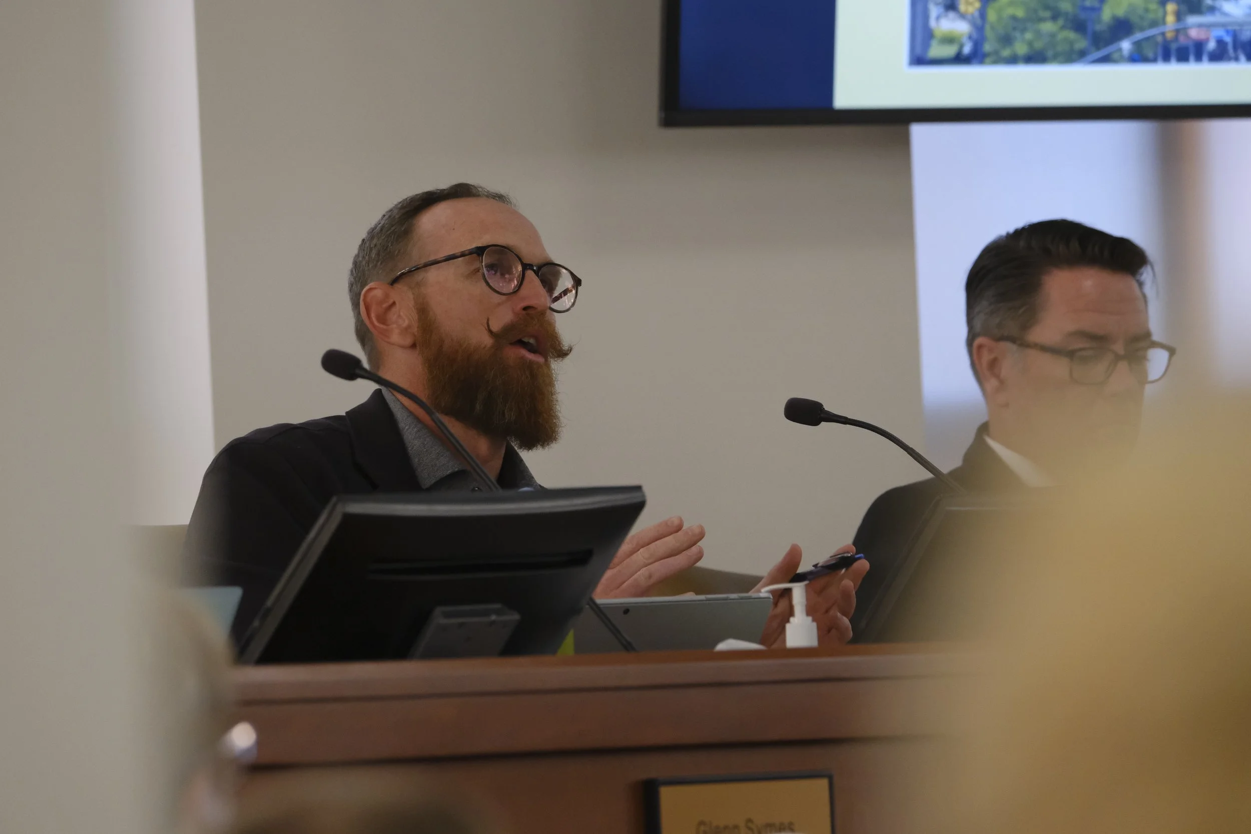 Council member Kevin Lundell comments before the vote, expressing concerns about the timing and projected revenue of the managed parking plan.