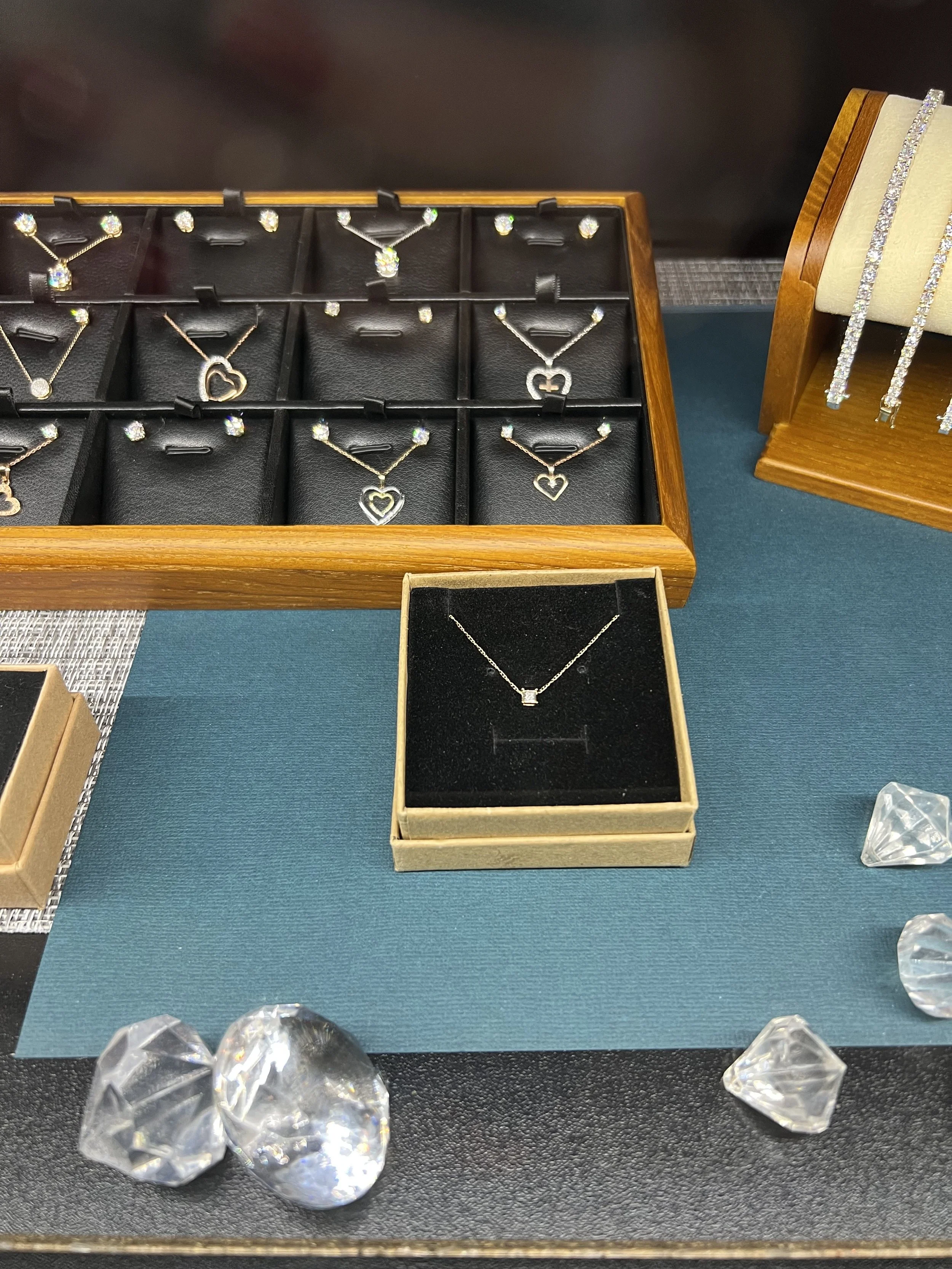 The Diamond Room has simple classics, a solitary pendant or pair of stud earrings, for $100. 