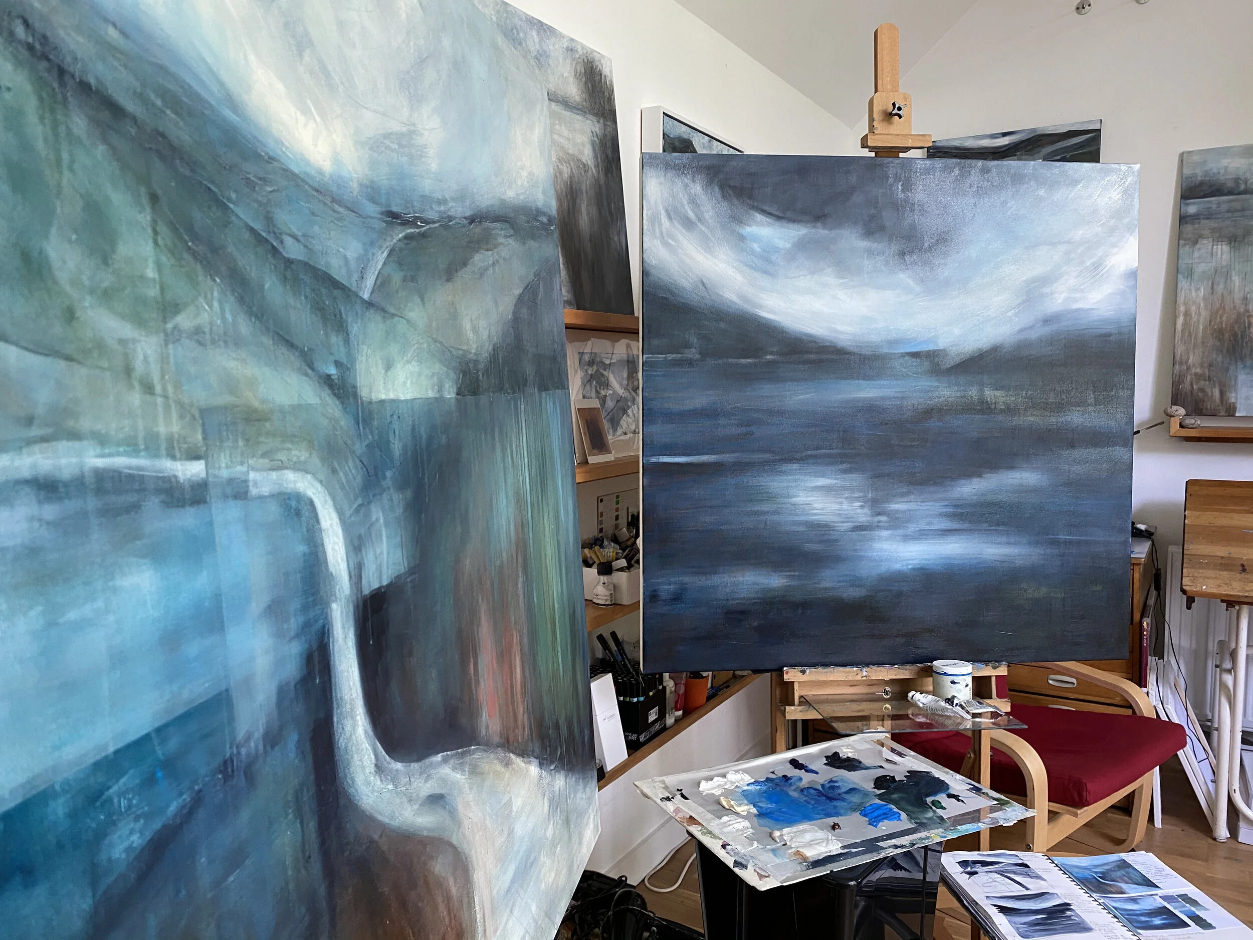 Studio shot showing the two large canvases in progress; All the Road Running on the left and ‘Water to Think: Water to Drink’ on the right hand easel.You can also see my painting notebook with thumbnails and colour swatches etc…and my palette, made from a piece of thin acrylic which I cover with wet kitchen towel and a layer of greaseproof paper, which makes an excellent stay wet surface for acrylics.