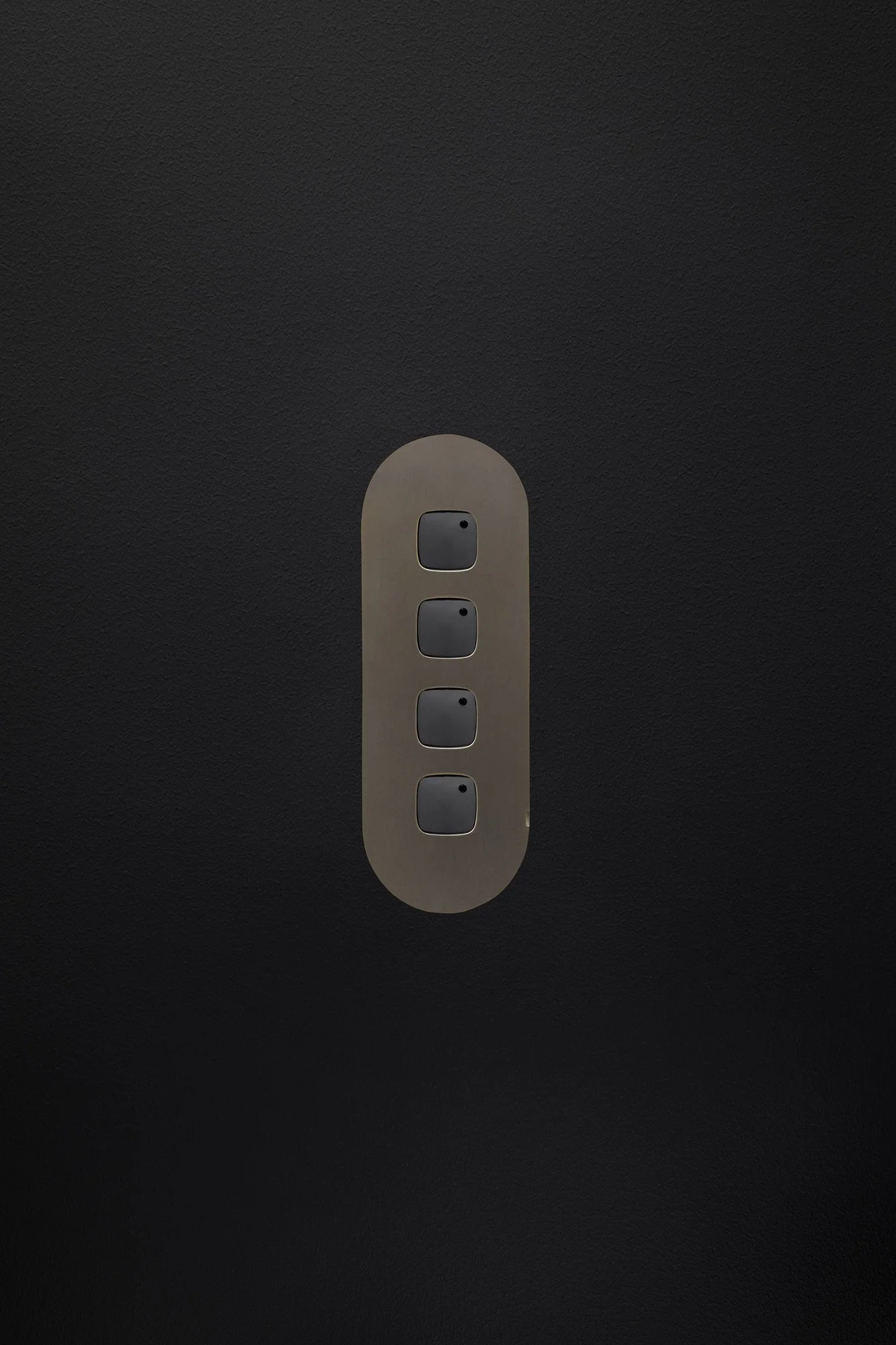 Four_Gang_Switch_Dark_Bronze_Black_Buttons_Black_Board.jpg