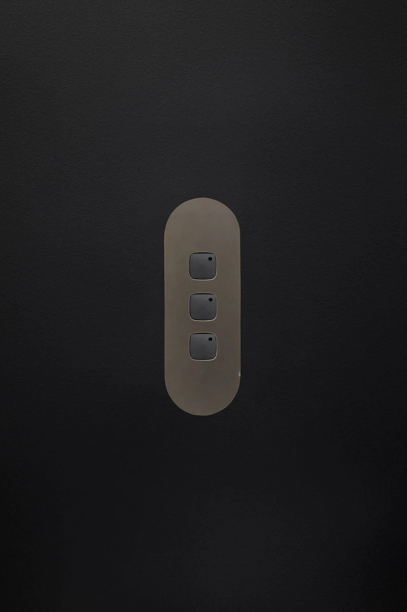 Three_Gang_Switch_Dark_Bronze_Black_Buttons_Black_Board.jpg