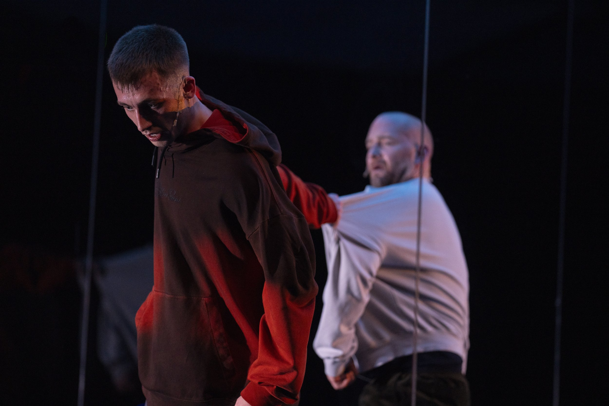 EM hanging over cliff holding on to HL.jpg