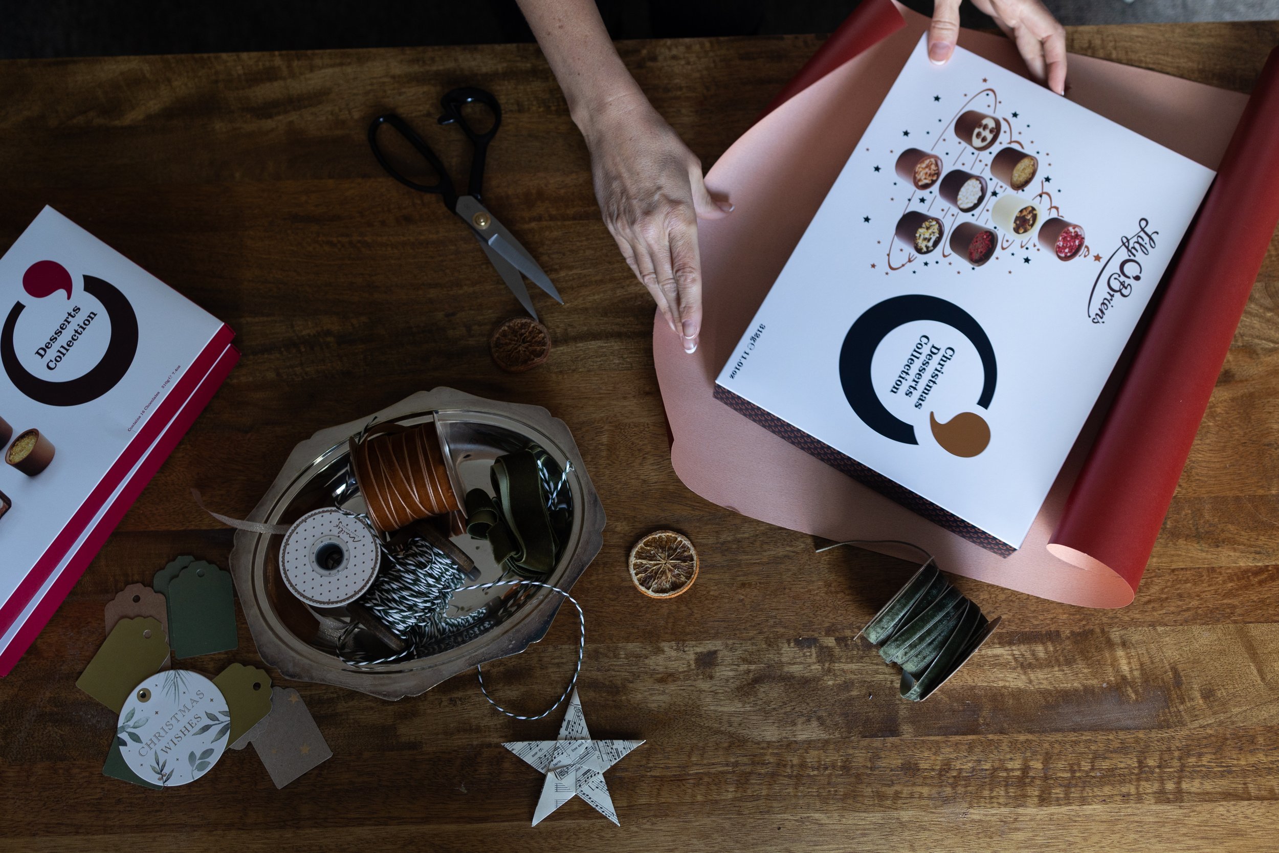 Woman-wrapping-chocolates-Chrismas-Cotswolds-Nina Raingold.jpg