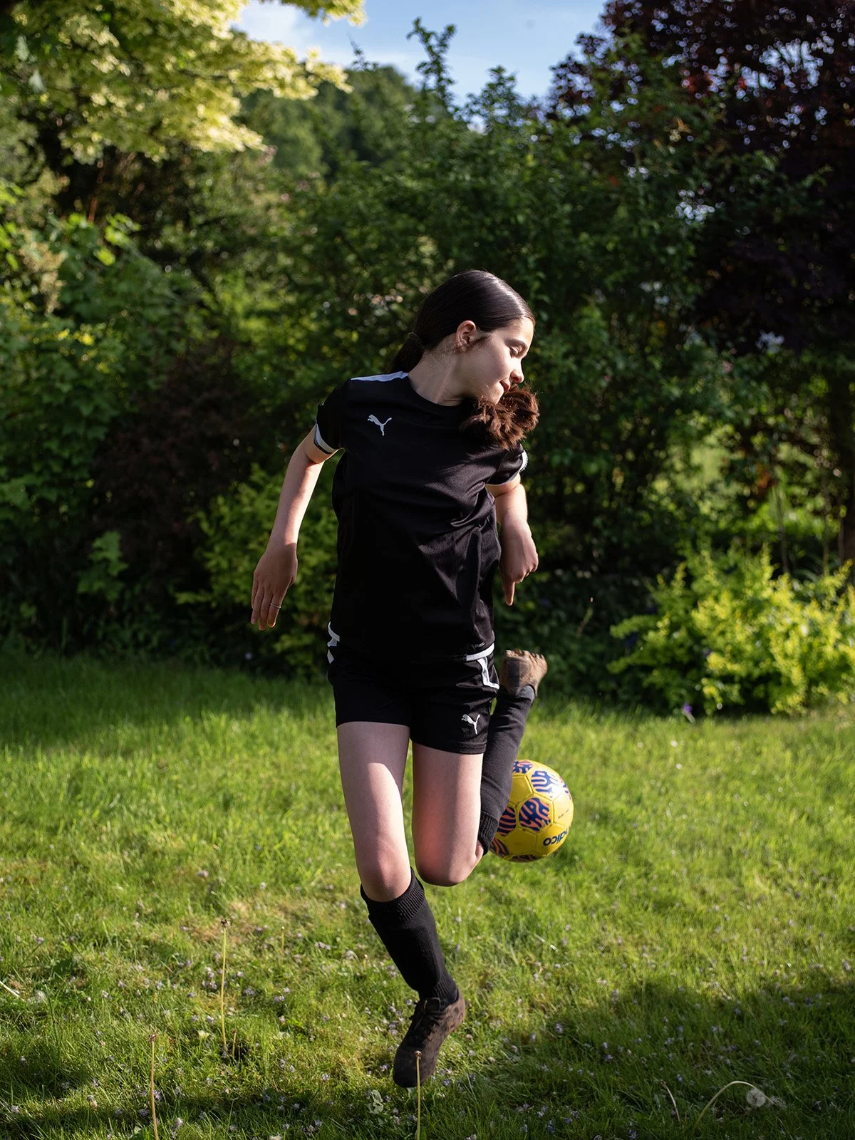 Girl-playing-football-portraiture-Nina Raingold.jpg