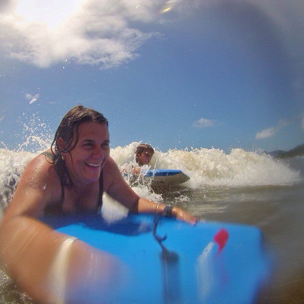 Body surfing the waves in TNQ is loads of FUN for all ages!!