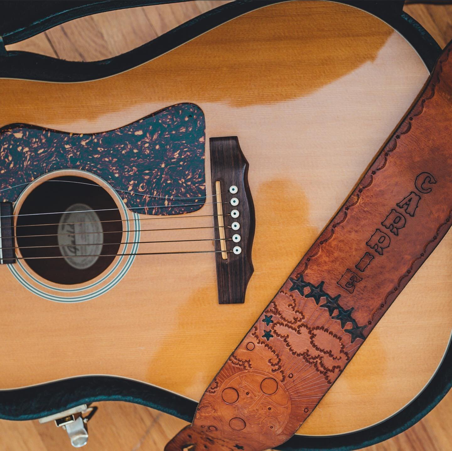 I remember seeing this guitar strap for the first time when I was a kid. I traced the illustration with my finger, allured by the rich color and distinct smell of aged leather. I never knew where it came from, and never thought to ask my mom while sh