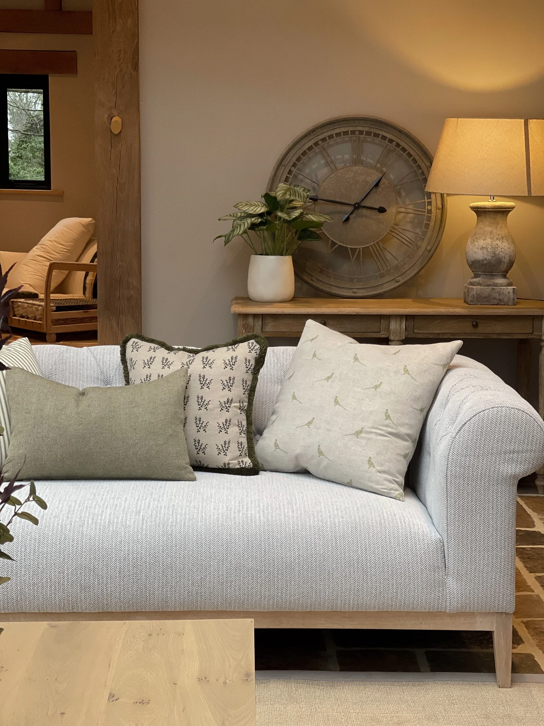 Alterme Home Heritage Collection cushion set styled on a sofa at the Finestock Home showroom.